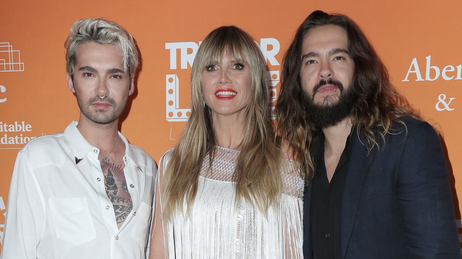 Zornige "Tokio Hotel"-Fans fragen sich, ob <strong>Heidi Klum</strong> bald zum "fünften Bandmitglied" wird.