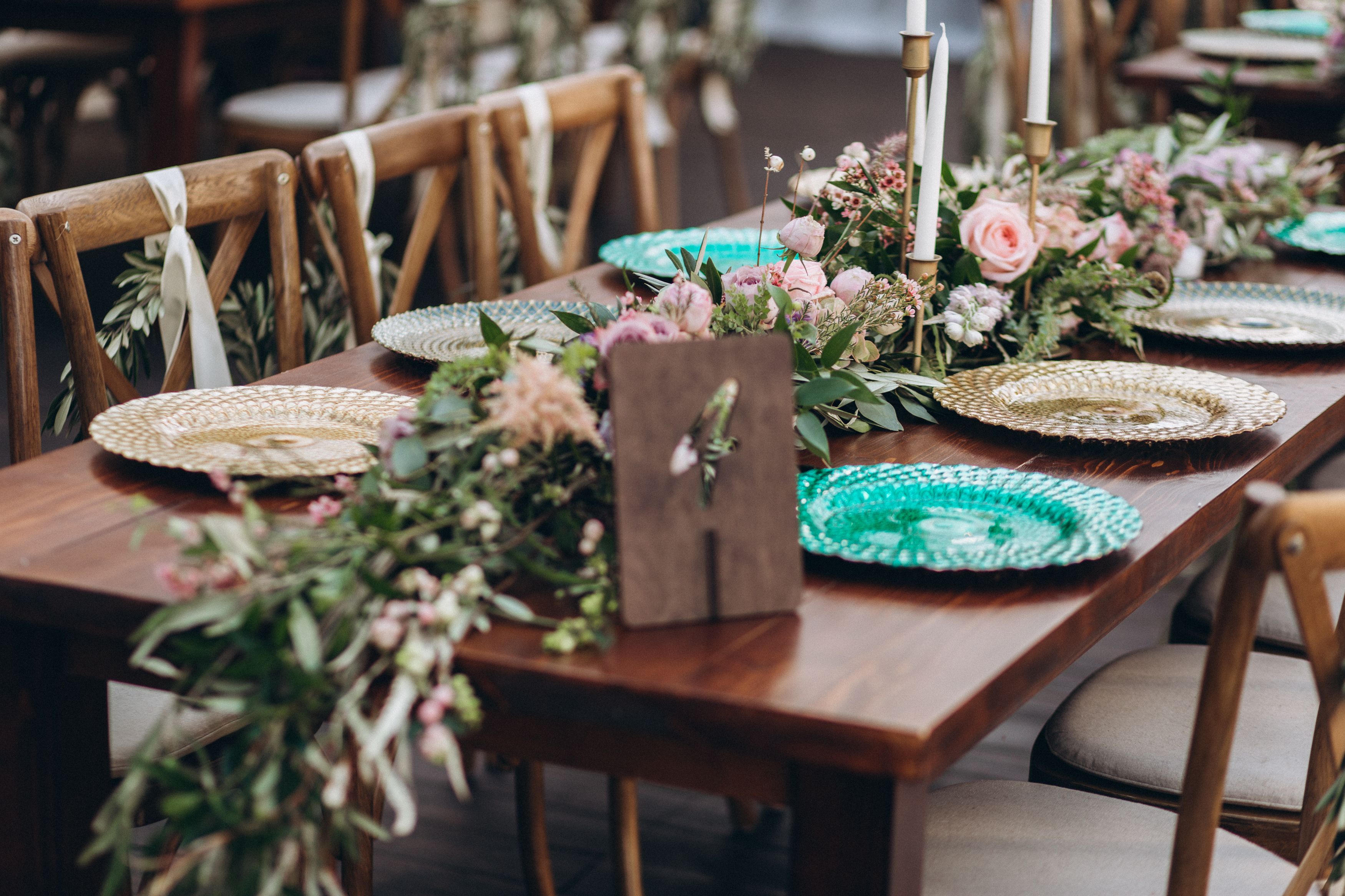 Wedding table for a newlywed banquet with eco decor and floral design in the style of boho.