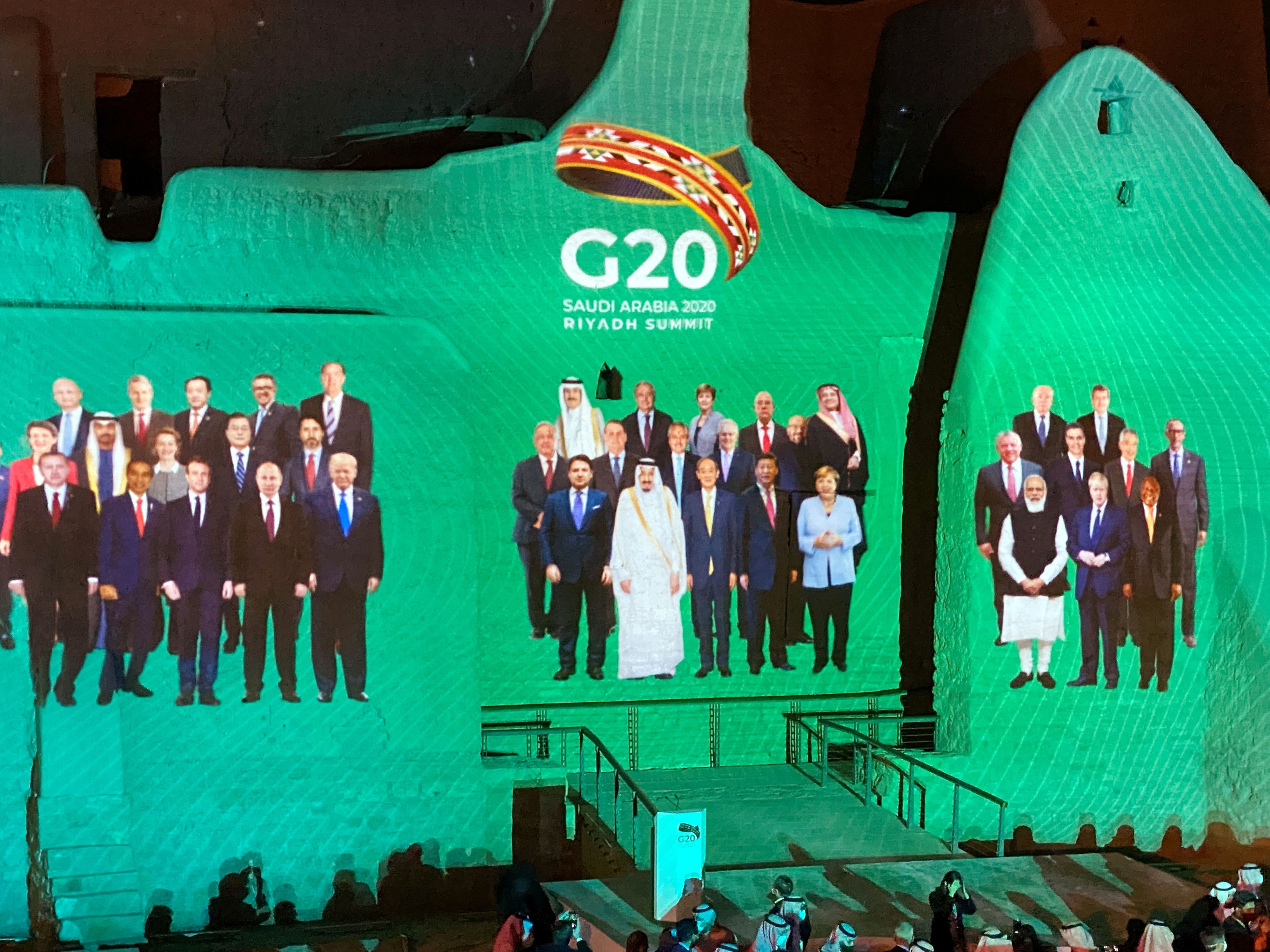 "Family Photo" for annual G20 Summit World Leaders is projected onto Salwa Palace in At-Turaif, one of Saudi Arabia?s UNESCO World Heritage sites, in Diriyah, Saudi Arabia, November 20, 2020. REUTERS/Nael Shyoukhi