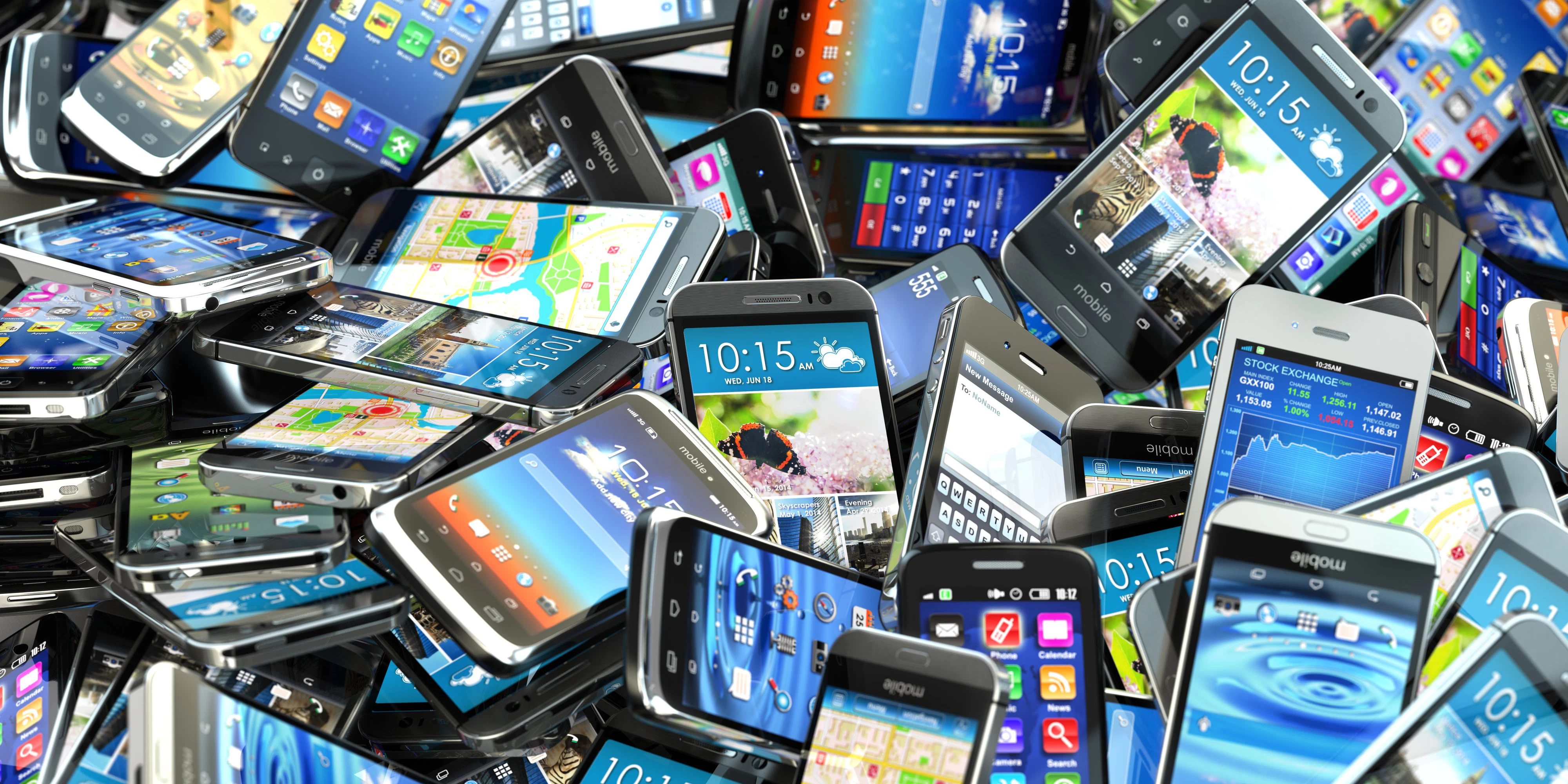 Mobile phones background. Pile of different modern smartphones. 3d