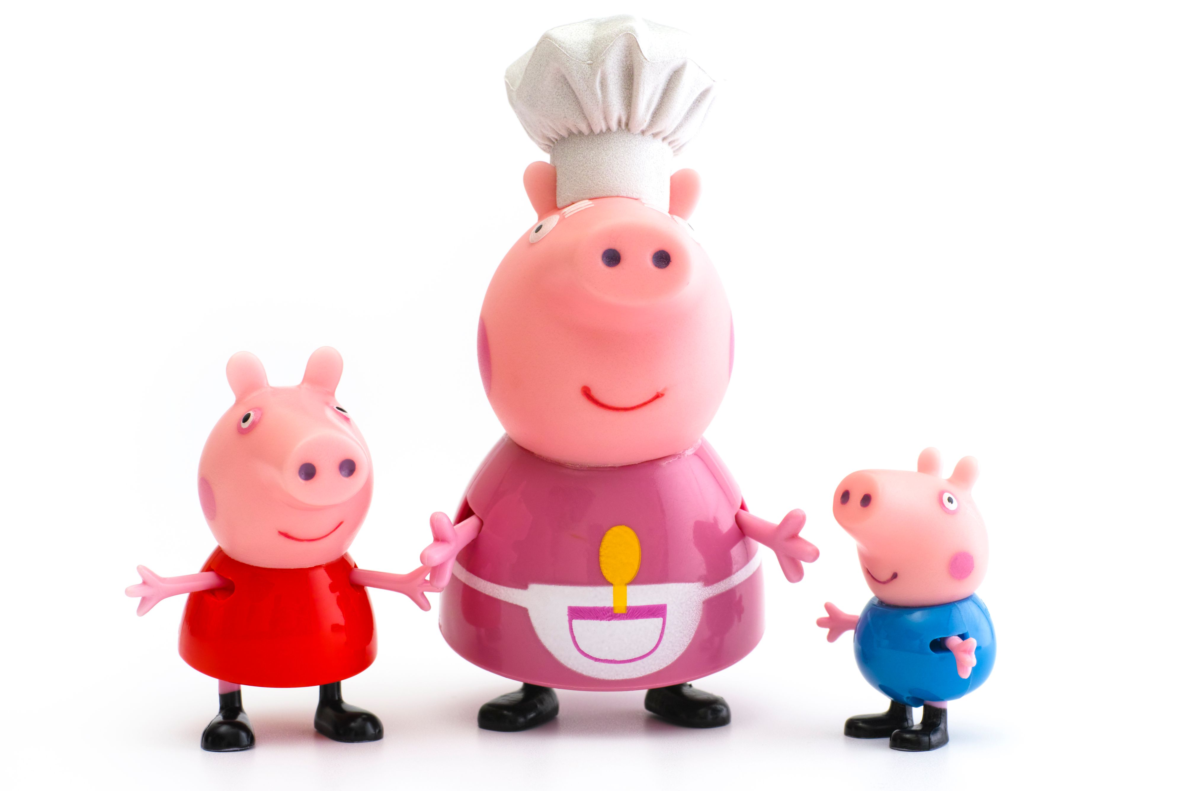 Tambov, Russian Federation - December 16, 2015: Peppa Pig, George Pig and Granny Pig toy characters on white background. Studio shot.