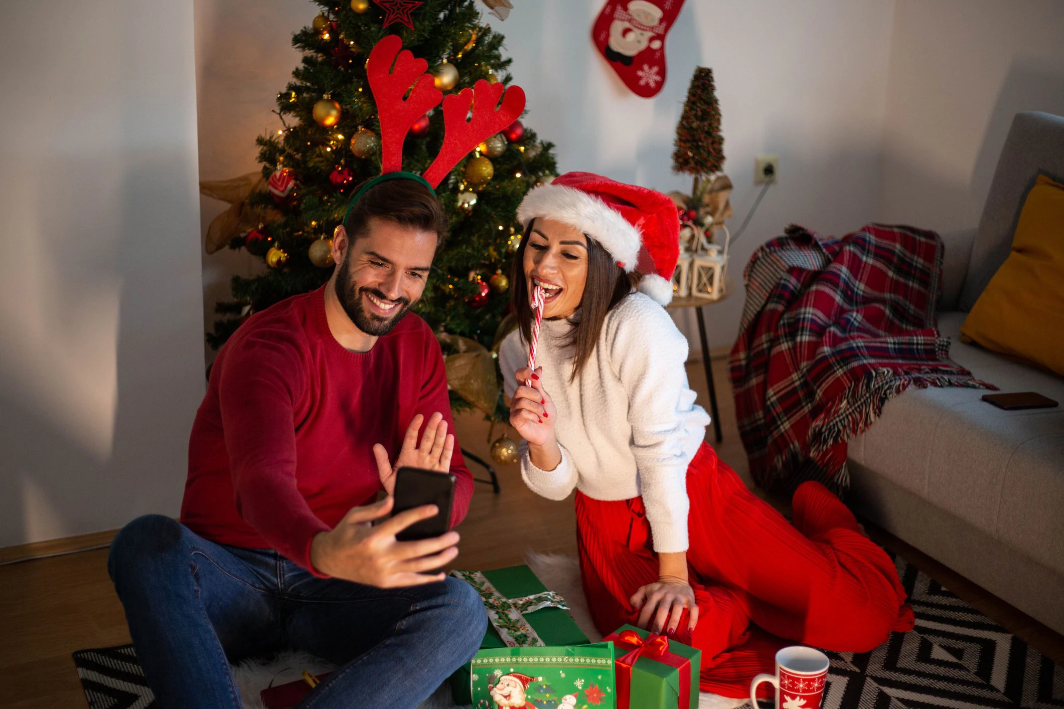 The young couple wishes a happy new year to family and friends over the phone