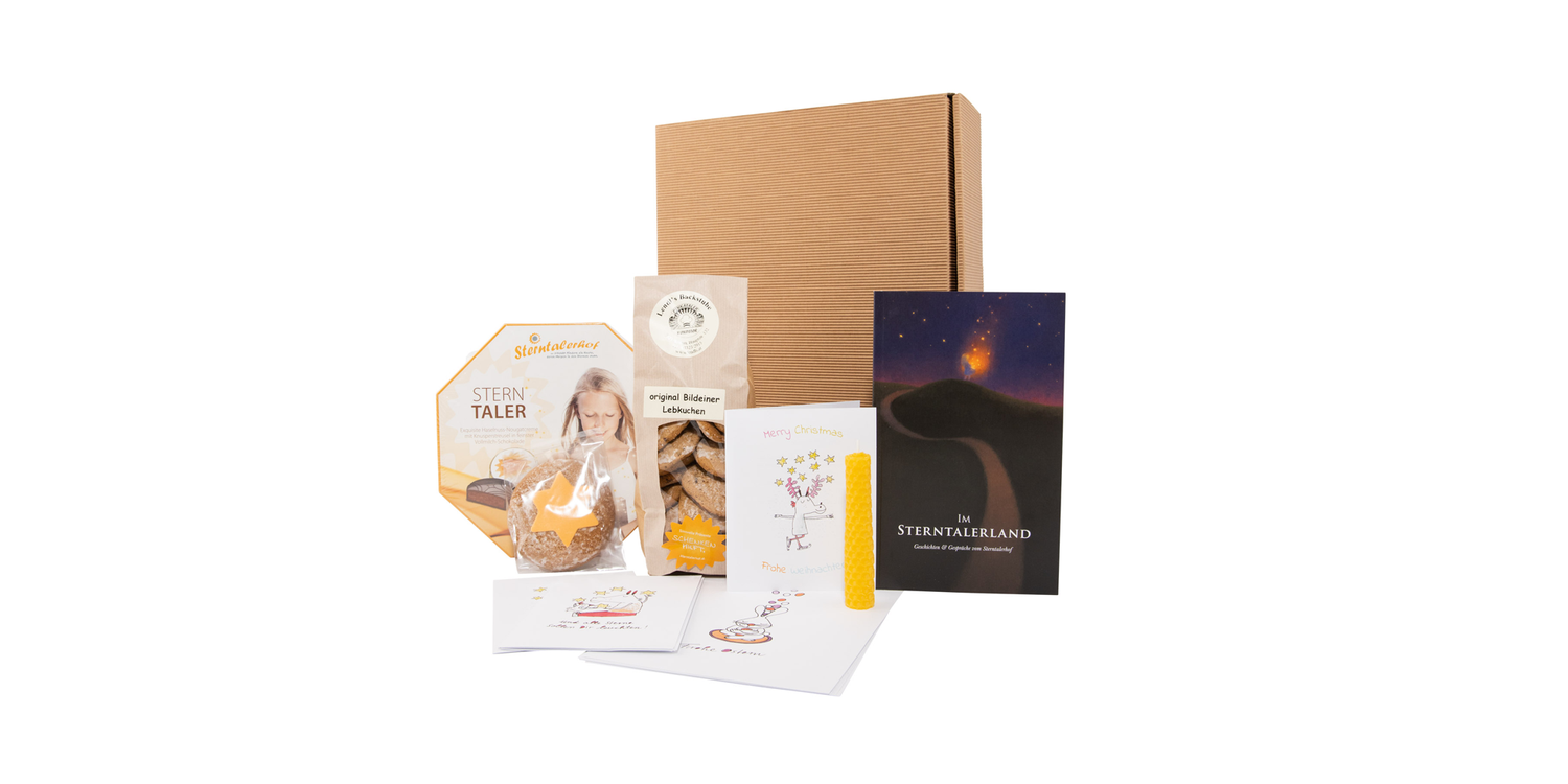 Die Geschenkbox <em>"Frohe Weihnachten"</em> beinhaltet unter anderem die köstlichen Schoko-Sterntaler.