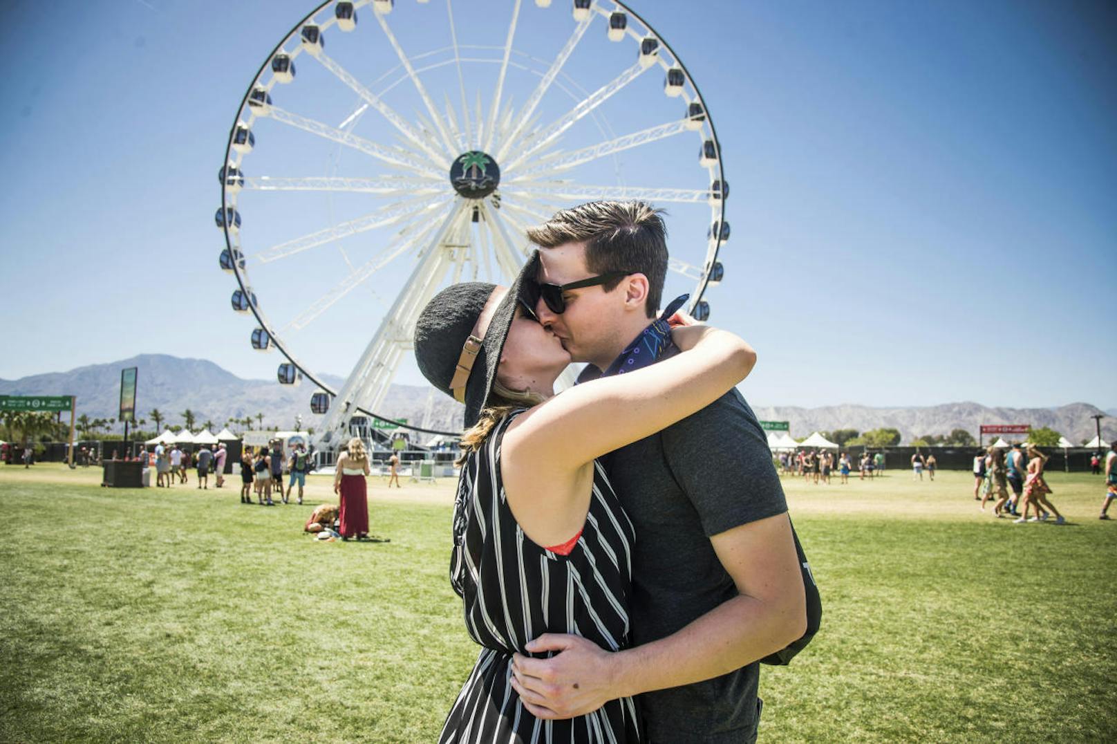 Festival goers Sarah Willetts, left, and Alex Deluccia embrace at Coachella Music & Arts Festival at the Empire Polo Club on Saturday, April 15, 2017, in Indio, Calif. (Photo by Amy Harris/Invision/AP)