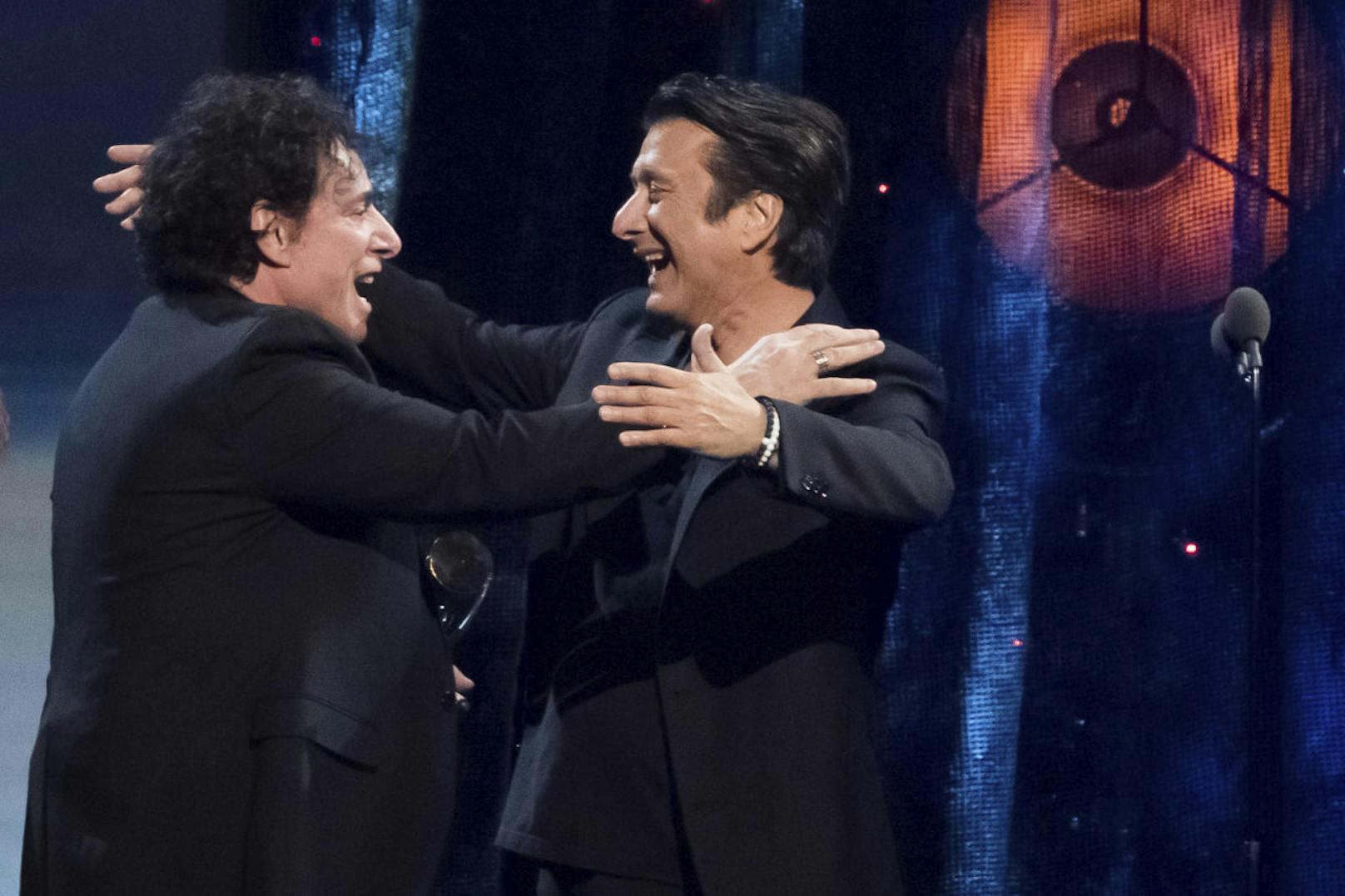 Inductees Neal Schon, left, and Steve Perry from the band Journey embrace at the 2017 Rock and Roll Hall of Fame induction ceremony at the Barclays Center on Friday, April 7, 2017, in New York. (Photo by Charles Sykes/Invision/AP)