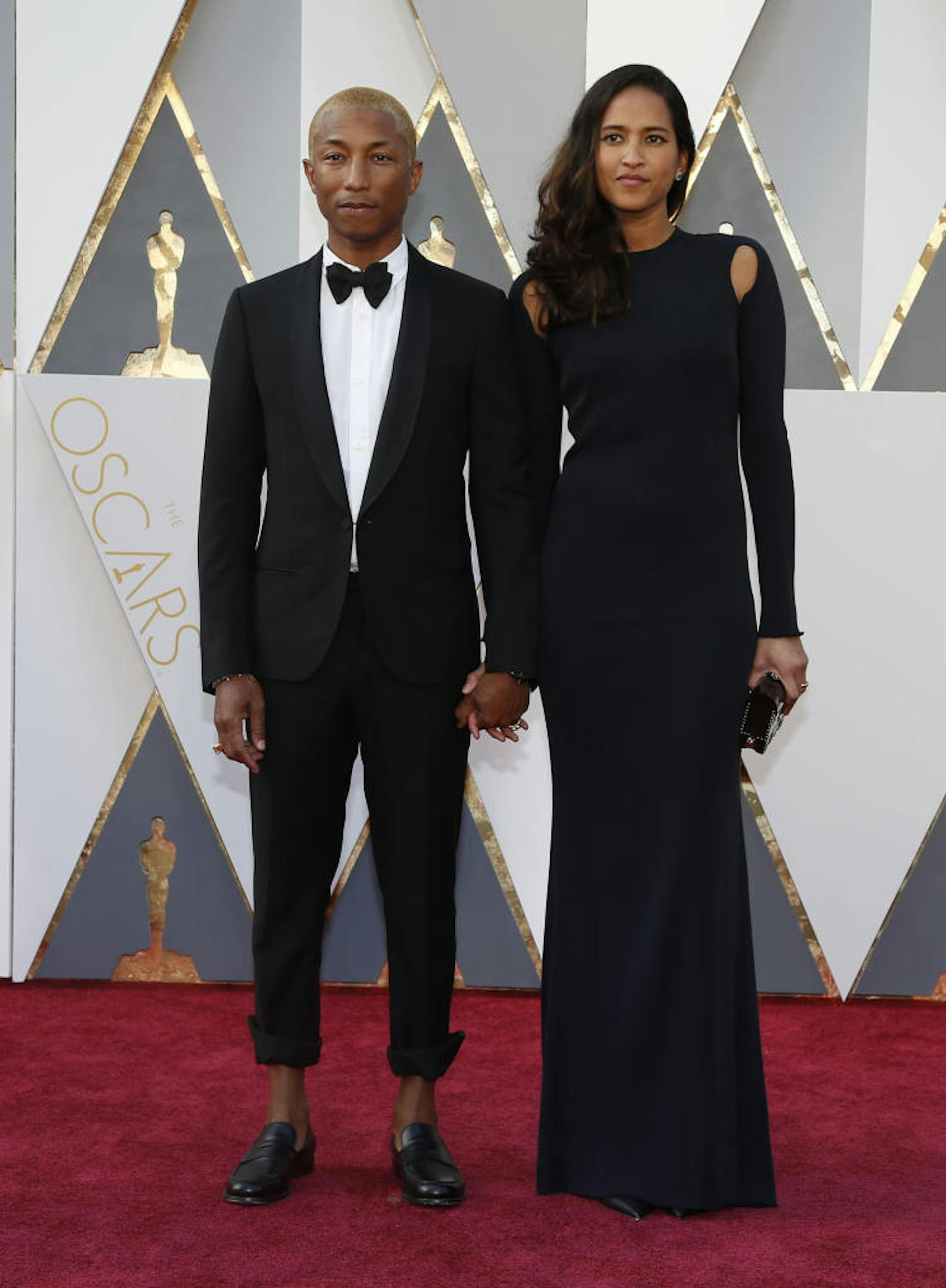 Singer Pharrell Williams and wife Helen Lasichanh arrive at the 88th Academy Awards in Hollywood, California February 28, 2016.  REUTERS/Lucy Nicholson - RTS8G3Z