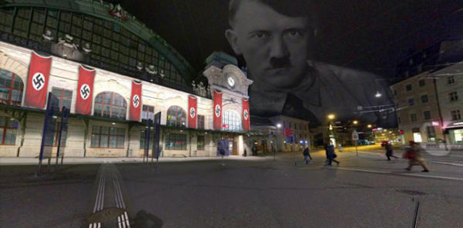Der Bahnhof Basel mit Nazi-Flaggen und dem Antlitz von Adolf Hitler ist zu sehen...
