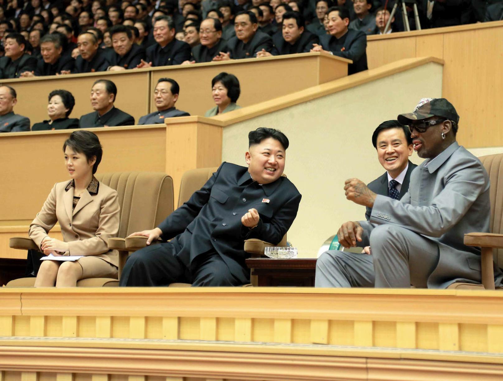 North Korean leader Kim Jong Un (2nd L) watches a basketball game between former U.S. NBA basketball players and North Korean players of the Hwaebul team of the DPRK with Dennis Rodman (R) at Pyongyang Indoor Stadium in this undated photo released by North Korea's Korean Central News Agency (KCNA) in Pyongyang January 9, 2014. REUTERS/KCNA (NORTH KOREA - Tags: POLITICS SPORT BASKETBALL TPX IMAGES OF THE DAY)  ATTENTION EDITORS - THIS PICTURE WAS PROVIDED BY A THIRD PARTY. REUTERS IS UNABLE TO INDEPENDENTLY VERIFY THE AUTHENTICITY, CONTENT, LOCATION OR DATE OF THIS IMAGE. FOR EDITORIAL USE ONLY. NOT FOR SALE FOR MARKETING OR ADVERTISING CAMPAIGNS. THIS PICTURE IS DISTRIBUTED EXACTLY AS RECEIVED BY REUTERS, AS A SERVICE TO CLIENTS. NO THIRD PARTY SALES. NOT FOR USE BY REUTERS THIRD PARTY DISTRIBUTORS. SOUTH KOREA OUT. NO COMMERCIAL OR EDITORIAL SALES IN SOUTH KOREA - RTX176Y4
