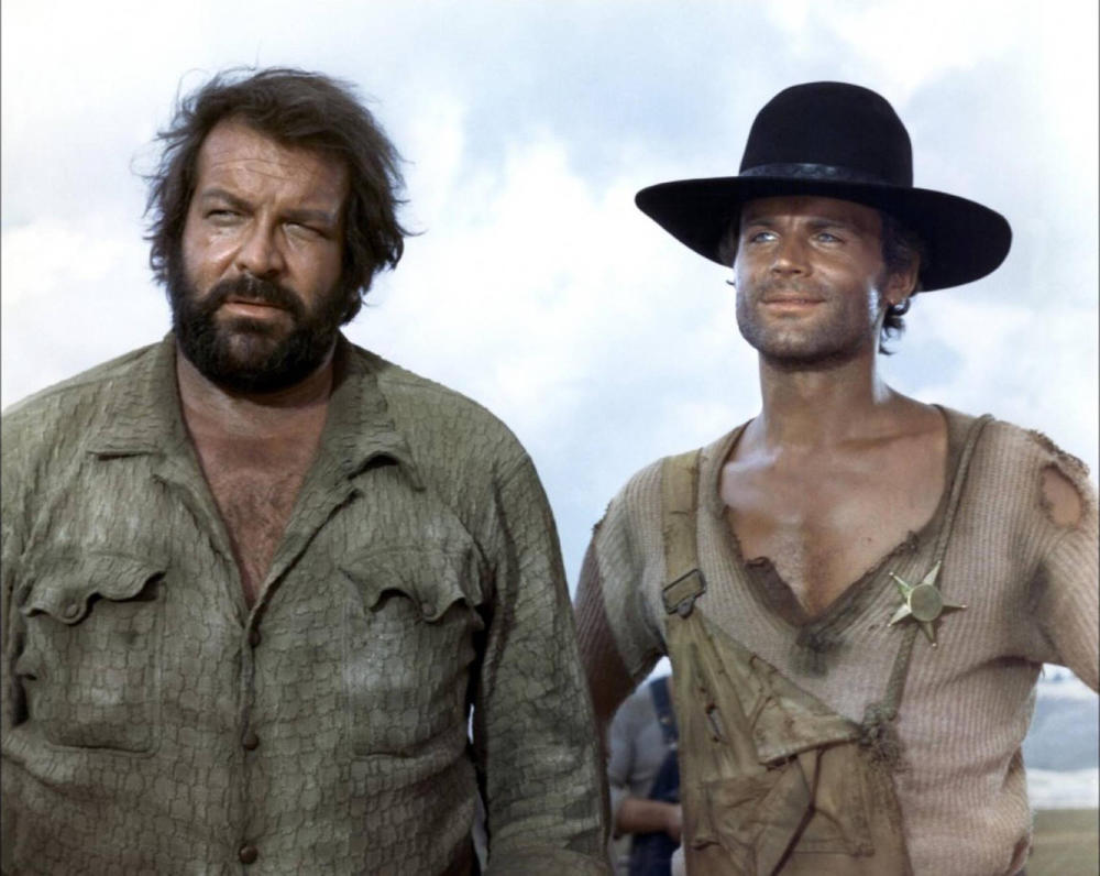 Bud Spencer und Terence Hill (bürgerlich Carlo Pedersoli und Mario Girotti) waren ein weltberühmtes italienisches Schauspieler-Duo, das ab den 1970er-Jahren vor allem durch humorvolle Spaghetti-Western und Action-Komödien mit handfesten, aber augenzwinkernden Prügeleien Kultstatus erlangte