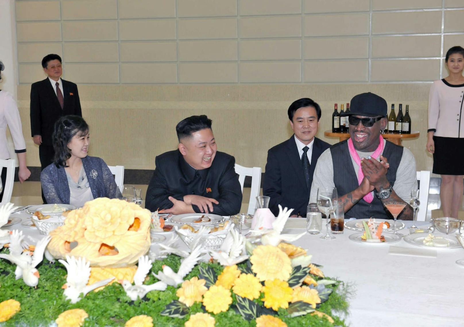 North Korean leader Kim Jong-Un (C), his wife Ri Sol-Ju (L) and former NBA basketball player Dennis Rodman (R) talk in Pyongyang in this undated picture released by North Korea's KCNA news agency on March 1, 2013. KCNA reported that a mixed basketball game of visiting U.S. basketball players and North Korean players was held at Ryugyong Jong Ju Yong Gymnasium in Pyongyang on February 28, 2013.     REUTERS/KCNA (NORTH KOREA - Tags: POLITICS SPORT TPX IMAGES OF THE DAY BASKETBALL) ATTENTION EDITORS - THIS PICTURE WAS PROVIDED BY A THIRD PARTY. REUTERS IS UNABLE TO INDEPENDENTLY VERIFY THE AUTHENTICITY, CONTENT, LOCATION OR DATE OF THIS IMAGE. THIS PICTURE IS DISTRIBUTED EXACTLY AS RECEIVED BY REUTERS, AS A SERVICE TO CLIENTS. QUALITY FROM SOURCE. NO THIRD PARTY SALES. NOT FOR USE BY REUTERS THIRD PARTY DISTRIBUTORS - RTR3EF7R