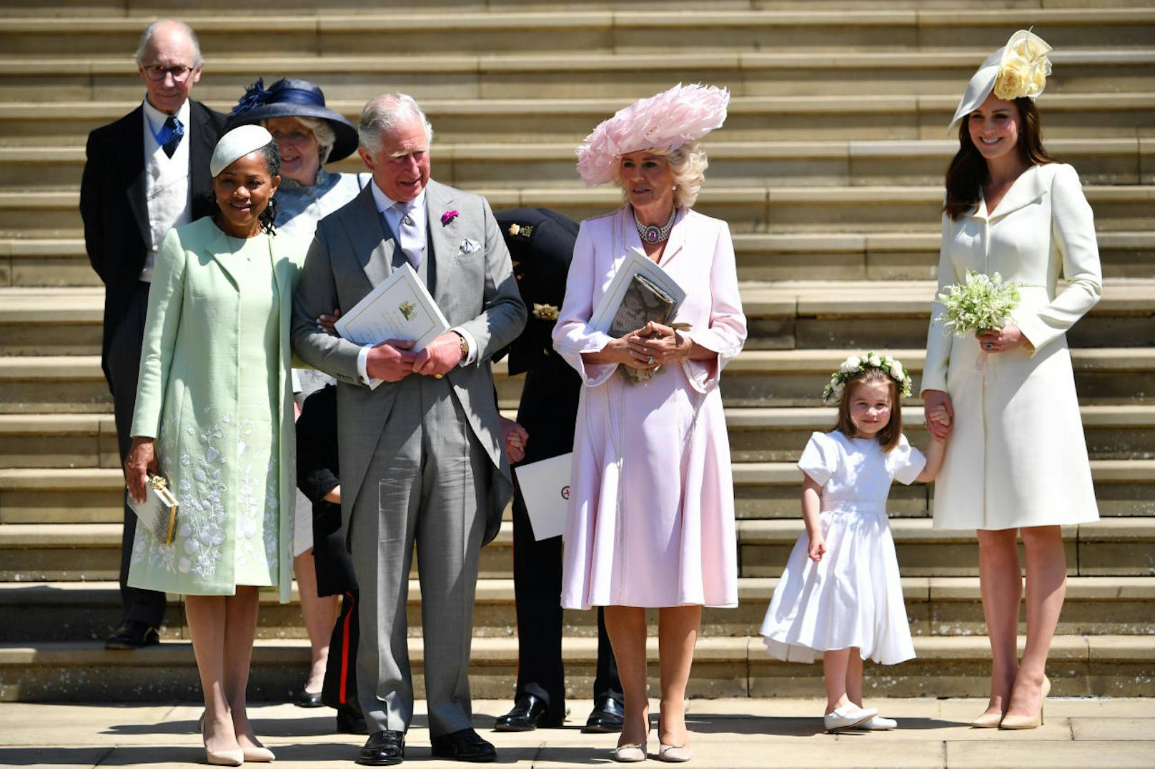 WINDSOR, UNITED KINGDOM - MAY 19:  (L-R) Doria Ragland, Prince Charles, Prince of Wales, Camilla, Duchess of Cornwall, and Catherine, Duchess of Cambridge holding her daughter Princess Charlotte's hand as they leave from the West Door of St George's Chapel, Windsor Castle, in Windsor on May 19, 2018 in Windsor, England. (Photo by  Ben STANSALL - WPA Pool/Getty Images)