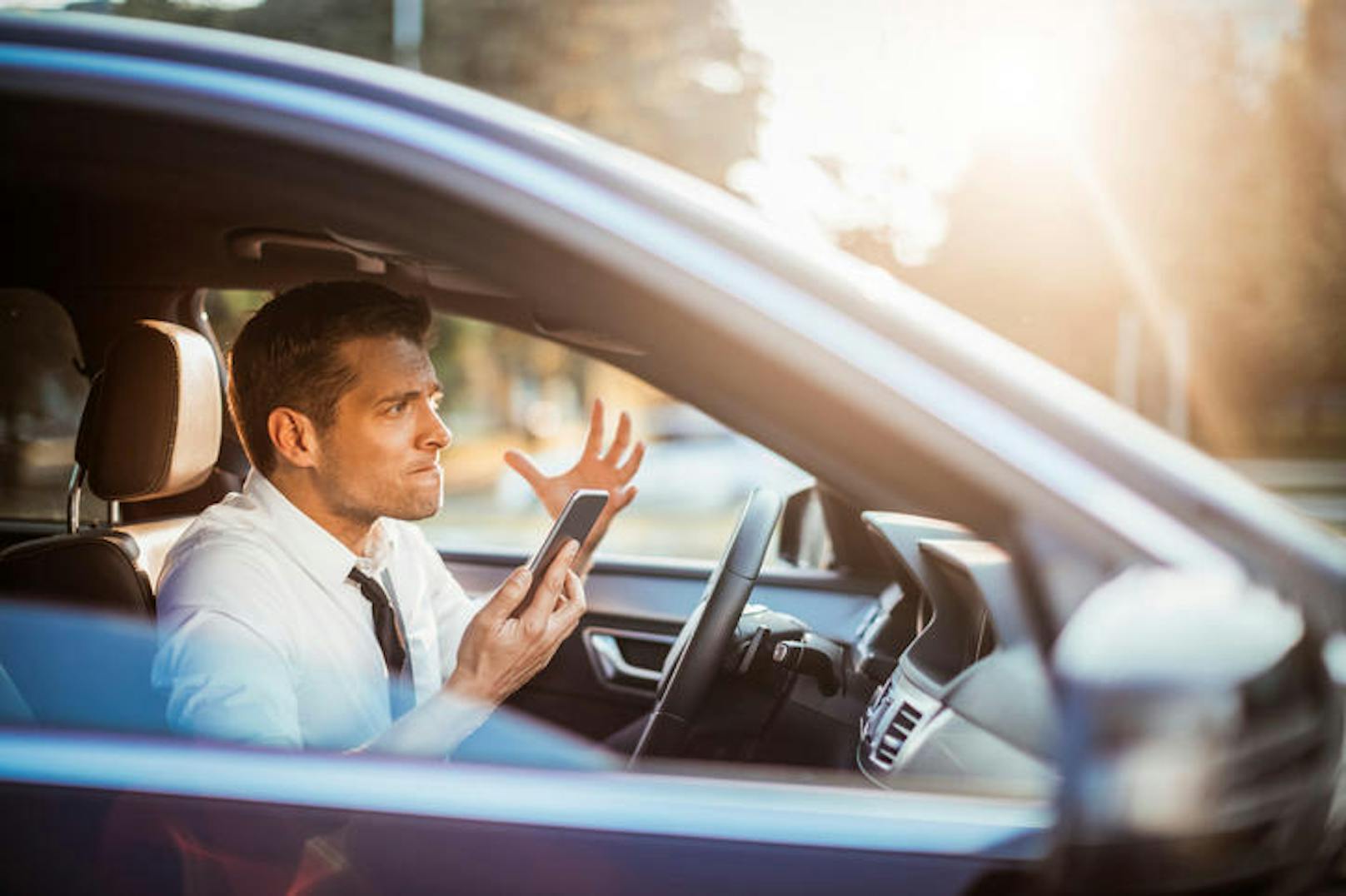 Close up photo of a businessman yelling at his phone