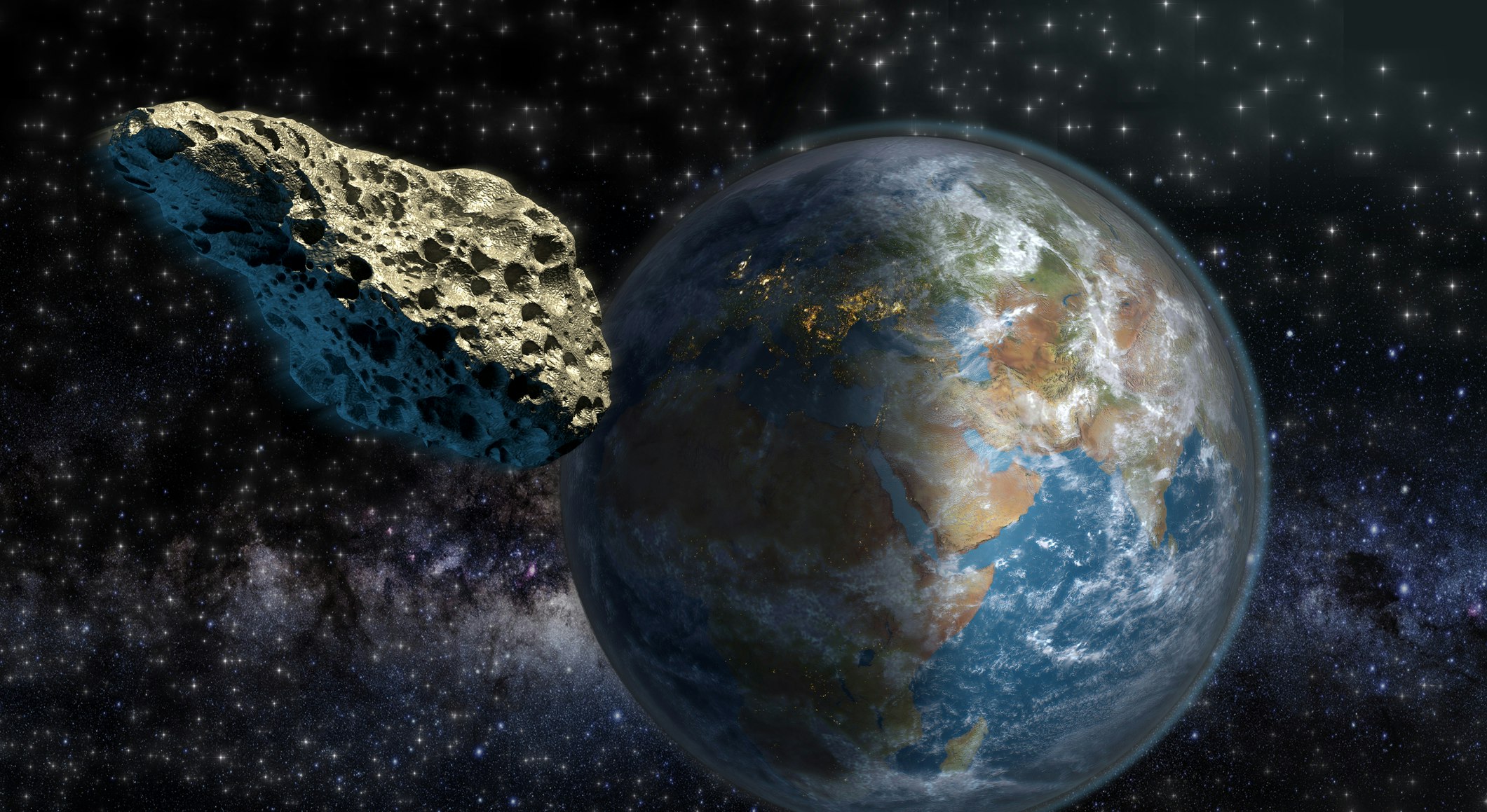 Ein Asteroid passiert die Erde. 