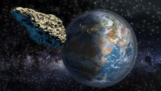 Ein Asteroid passiert die Erde. 