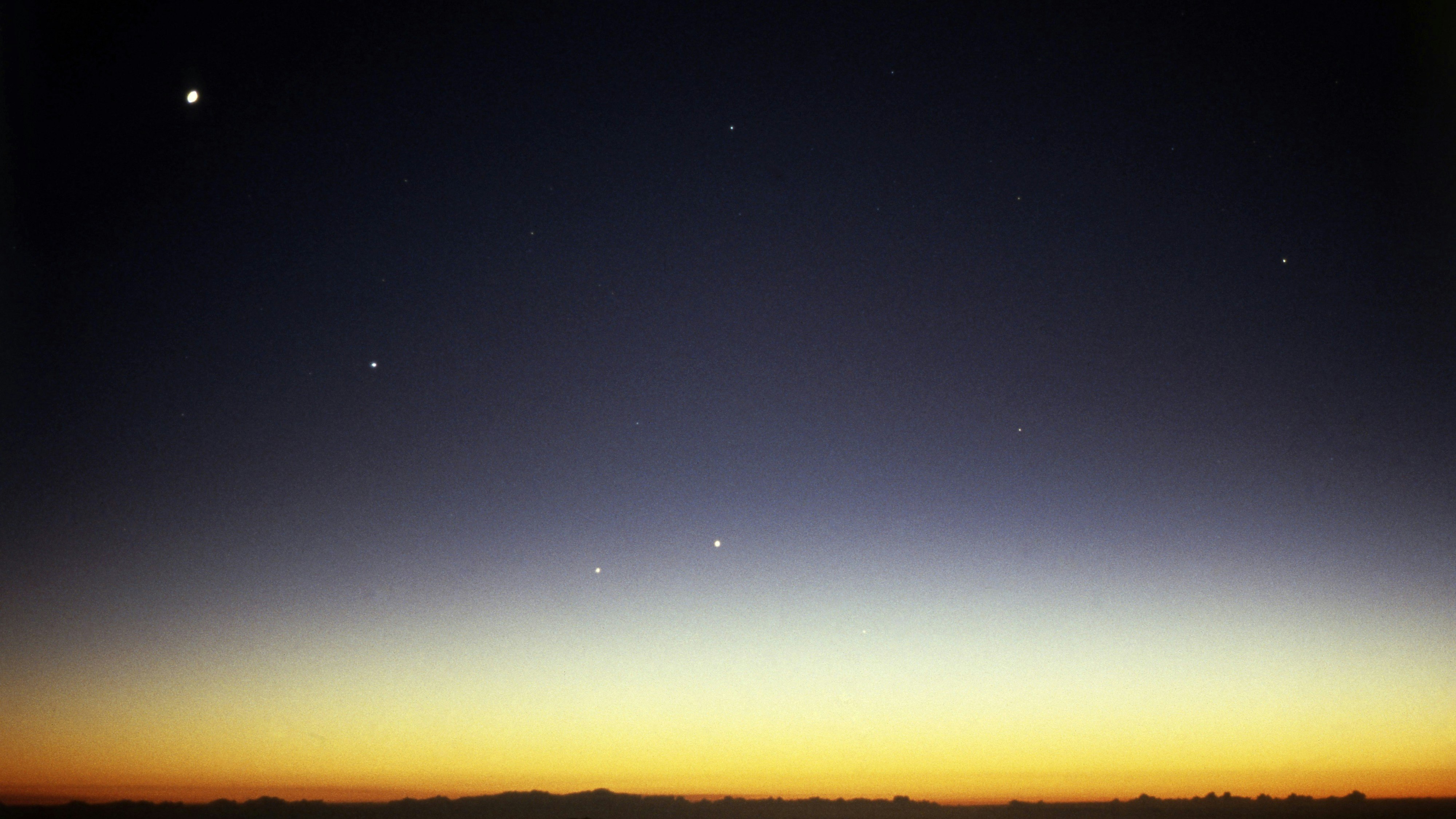 Photograph of the night sky & horizon taken just after sunset, showing the planets Venus, Mercury, Jupiter & Saturn.