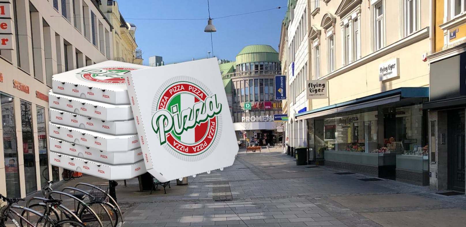 Symbolfoto von der St. Pöltner Innenstadt und Pizza-Kartons.