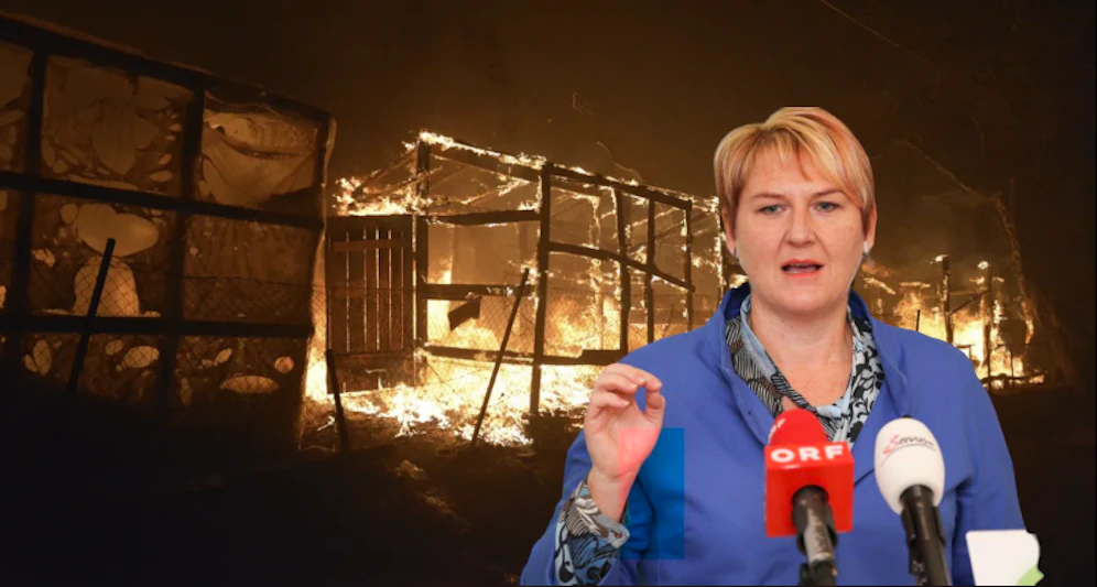 Krismer und das brennende Lager im Hintergrund.