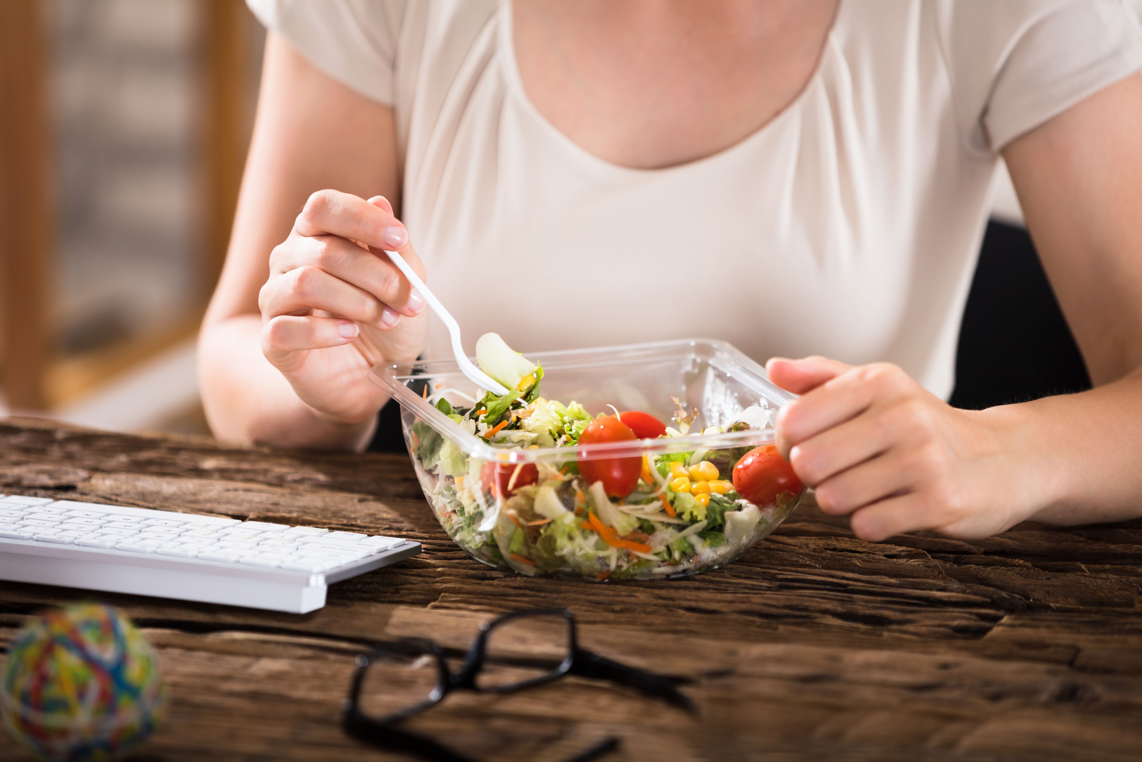 Close-up Of Woman Having A Lunch Break At Desk