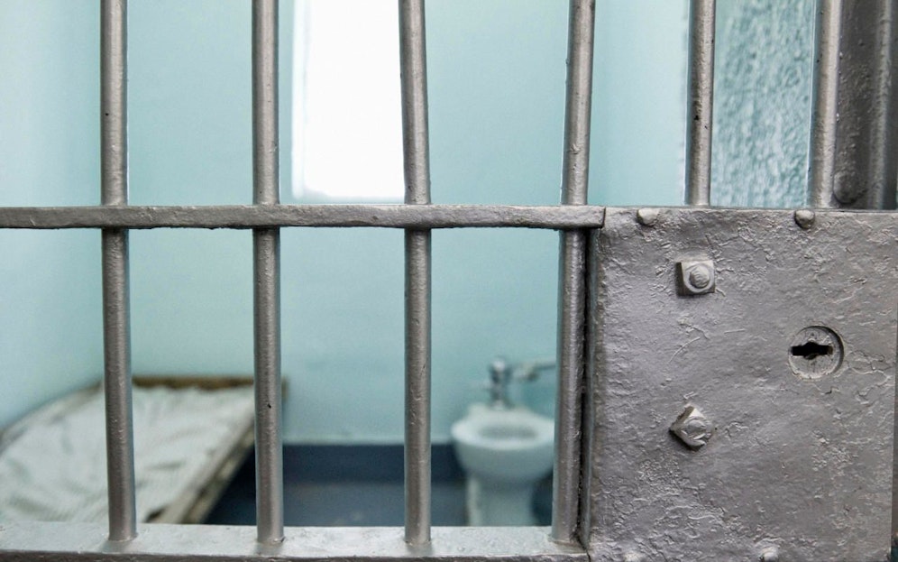 Jail cell with selective focus on bars. 
