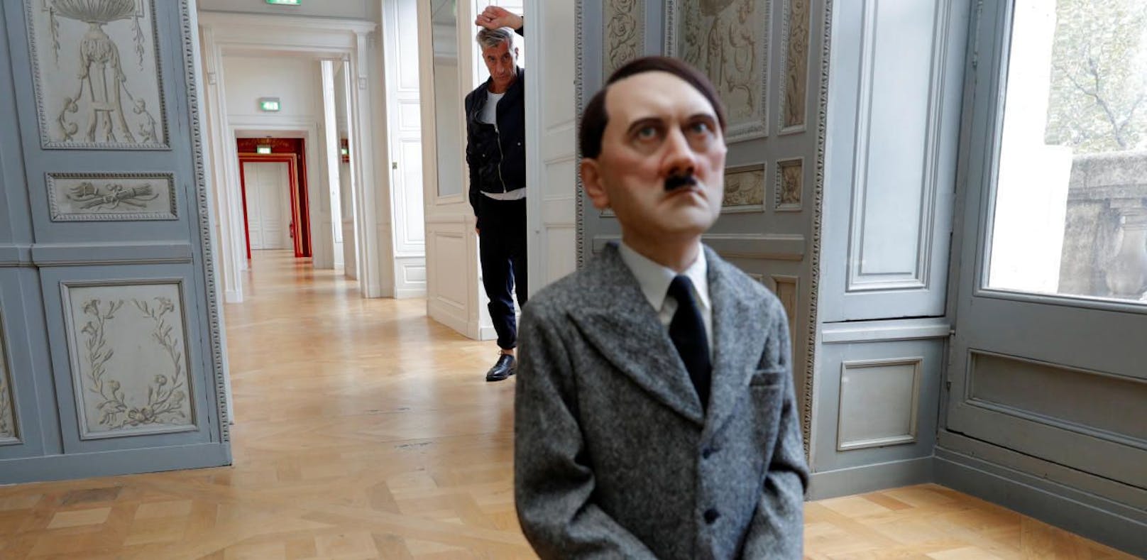 Italian artist Maurizio Cattelan poses with his creation &quot;Him&quot; (2001) prior to the opening of the exhibition &quot;Not Afraid of Love&quot; at the Hotel de la Monnaie in Paris, France, October 17, 2016. REUTERS/Philippe Wojazer - RTX2P6LN