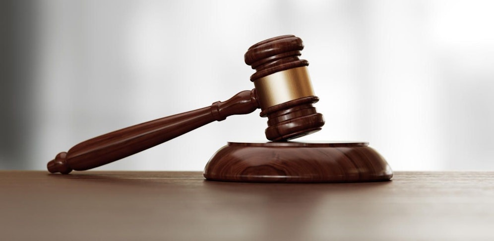 Wooden gavel over defocused background. Front view with selective focus. Great use for law, justice and auction related concepts.