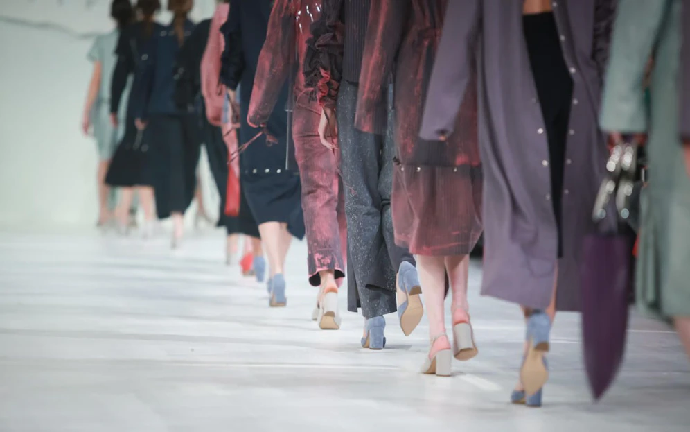 Fashion Show, Catwalk Runway Show Event. Detail of lined up rear view, fashion models.