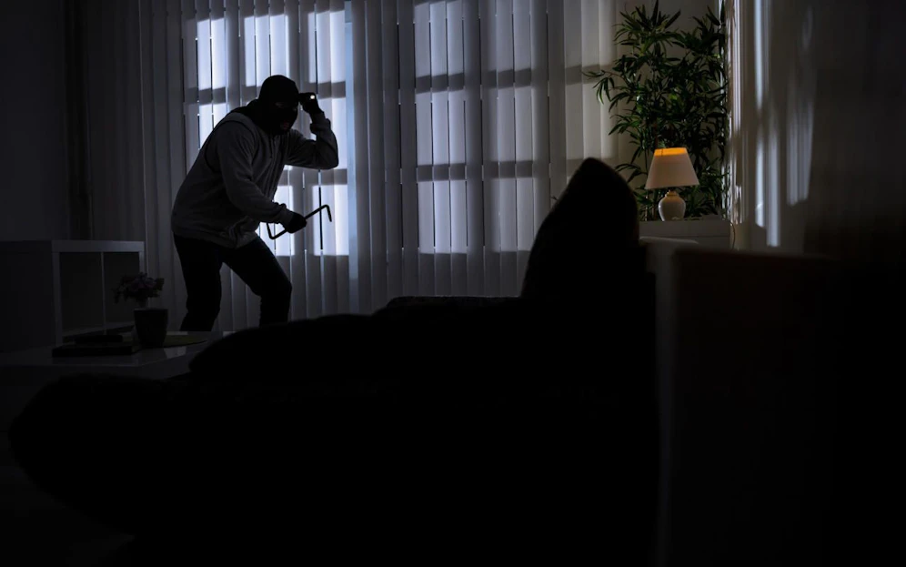  burglary with crowbar breaking into a home at night