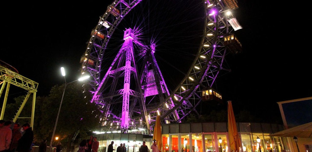 Das Wiener Riesenrad wird am Mädchentag in Pink erstrahlen (Fotomontage)