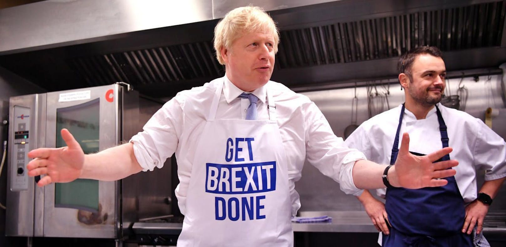 Britain's Prime Minister Boris Johnson prepares a pie at the Red Olive kitchen in Derby, Britain on December 11, 2019 on the final day of campaigning before a general election. Ben Stansall/Pool via REUTERS - RC2YSD97C2EF