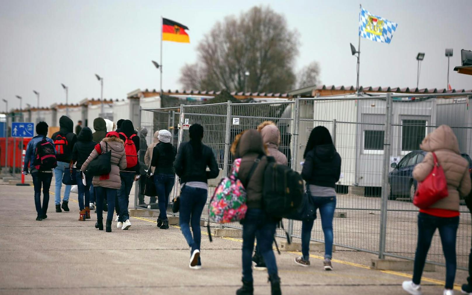 Eritrean migrants walk after arriving by plane from Italy at the first registration camp in Erding near Munich, Germany, November 15, 2016.  REUTERS/Michael Dalder - D1BEUMZGAGAB