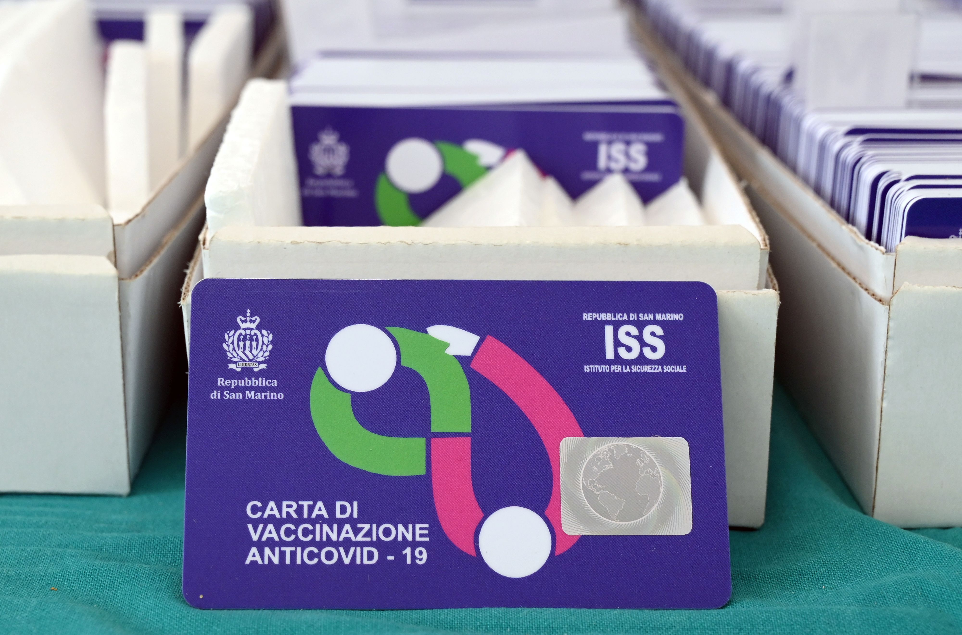 Vaccination cards are pictured, as the Republic of San Marino starts a campaign inviting tourists to get vaccinated with the Russia's Sputnik V vaccine against coronavirus disease, June 2, 2021. Picture taken June 2, 2021. REUTERS/Alberto Lingria