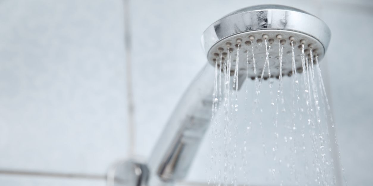 Shower in bathroom with water flowing