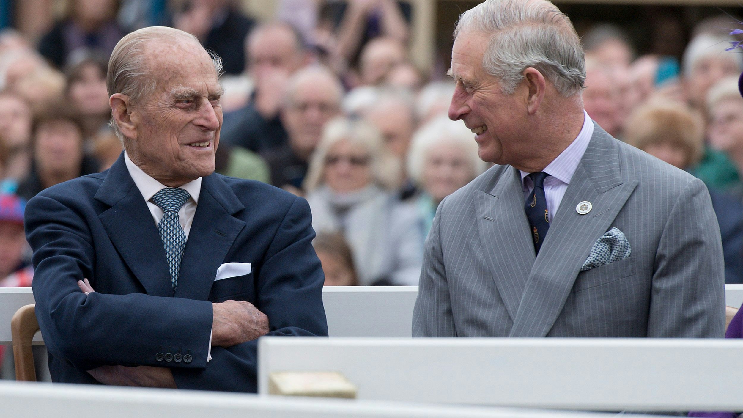 Britain's Prince Philip (L) and Prince Charles listen to speeches before the unveiling of a statue of Queen Elizabeth The Queen Mother in Poundbury, Britain October 27, 2016.  REUTERS/Justin Tallis/Pool