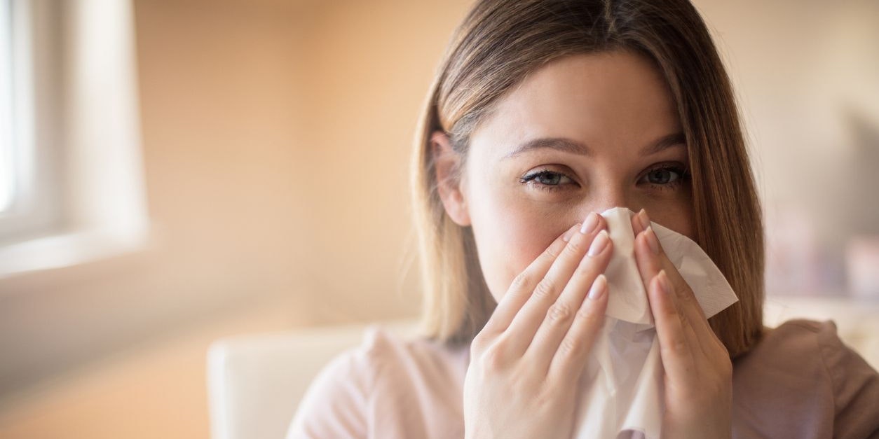 Business woman with flu virus. Close up.