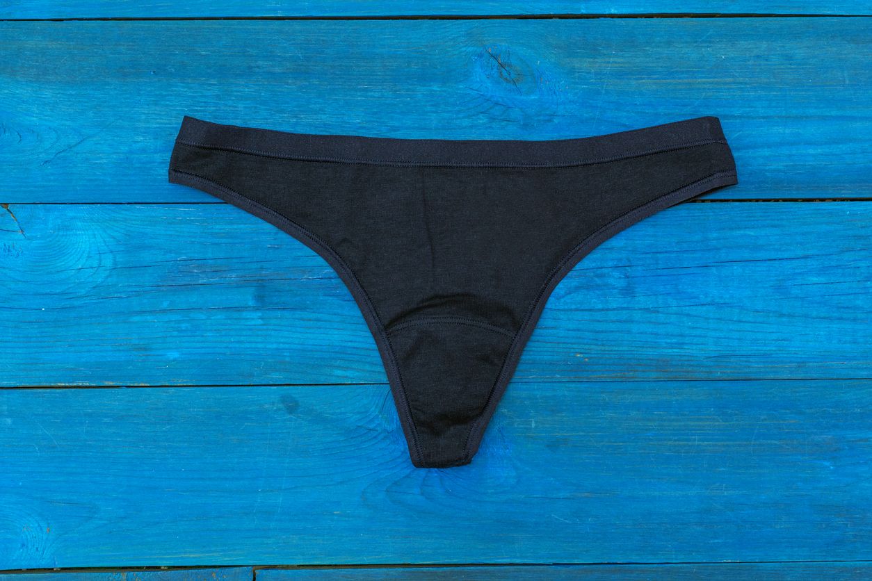 blue panties lying on the aged boards