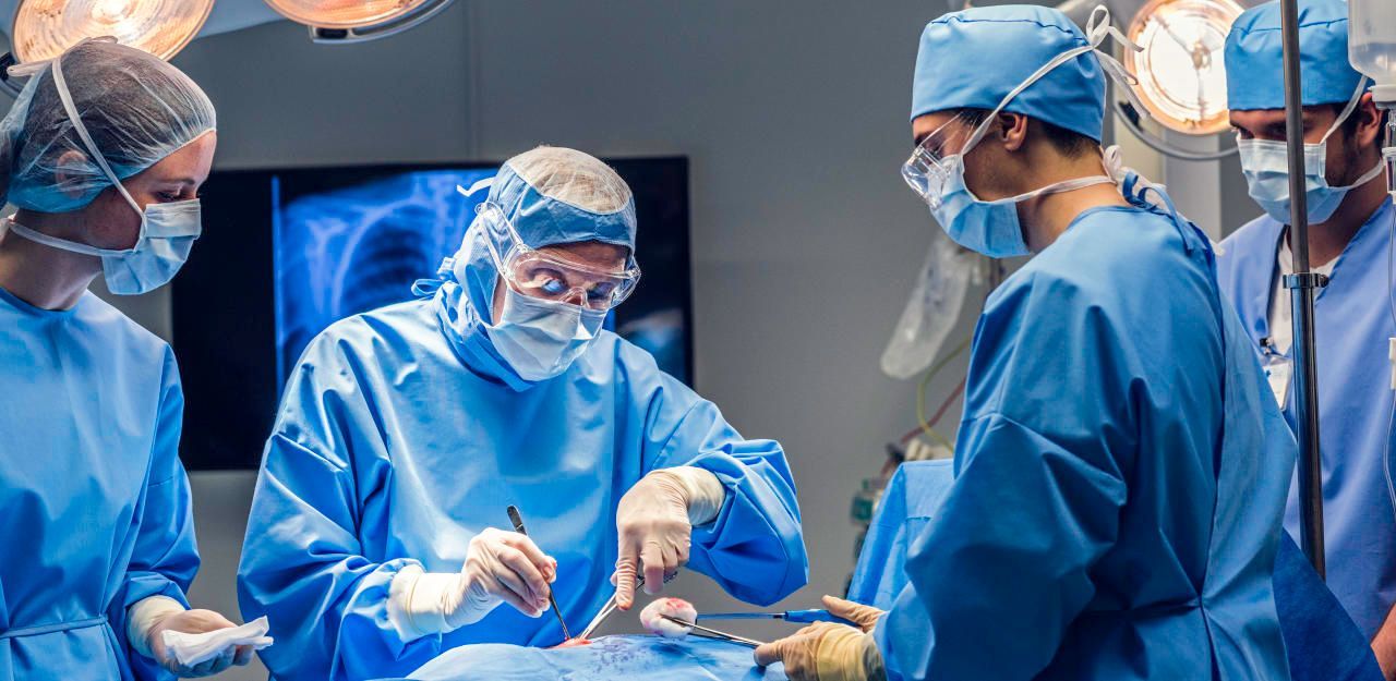 Surgeon team operating.