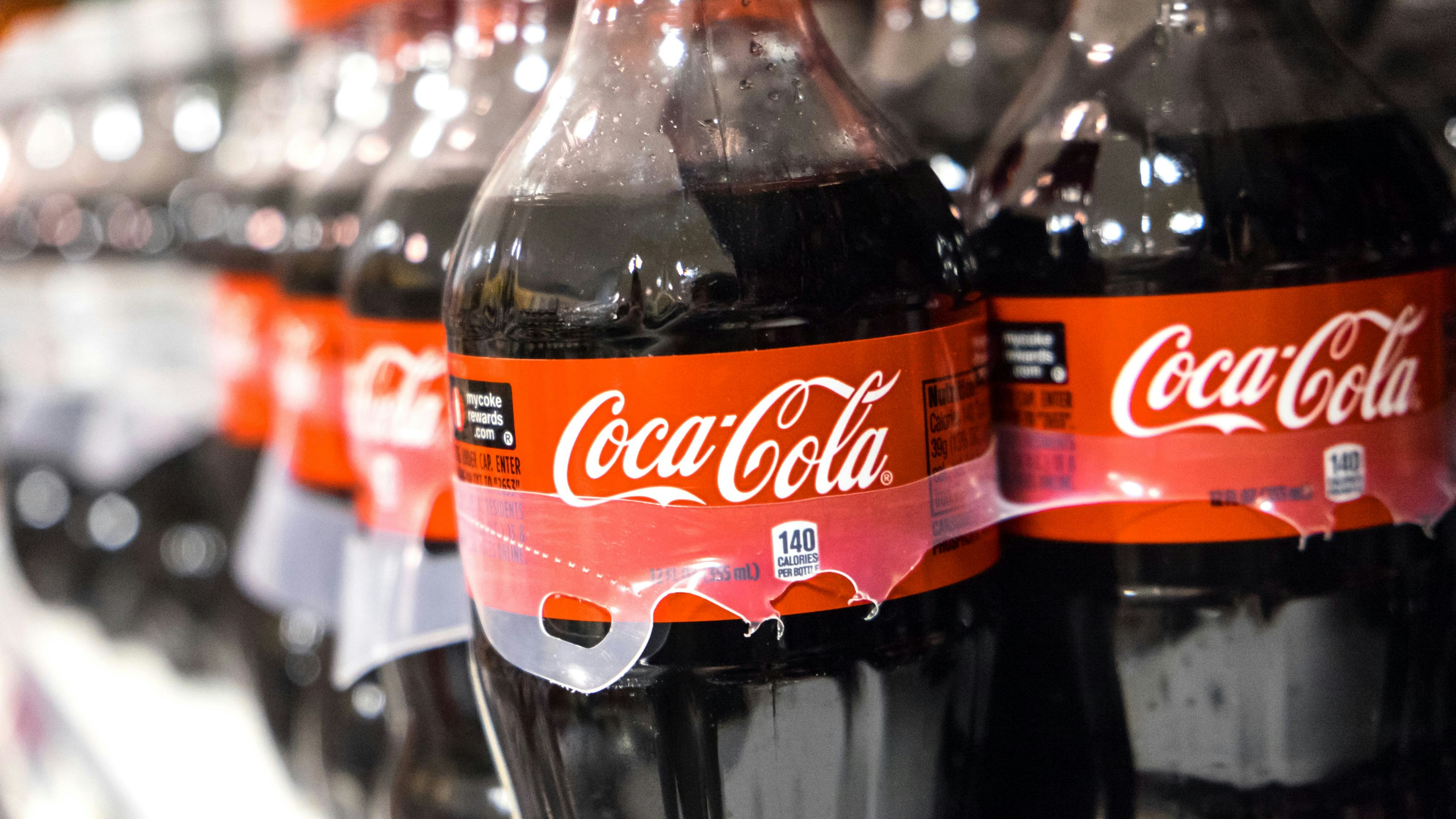 Miami, Florida, USA- March 27, 2014: 12 Fl ozs Plastic Bottles of Coca Cola in a warehouse Rack. The soft drink called also Coke is sold in over 200 countries worldwide.