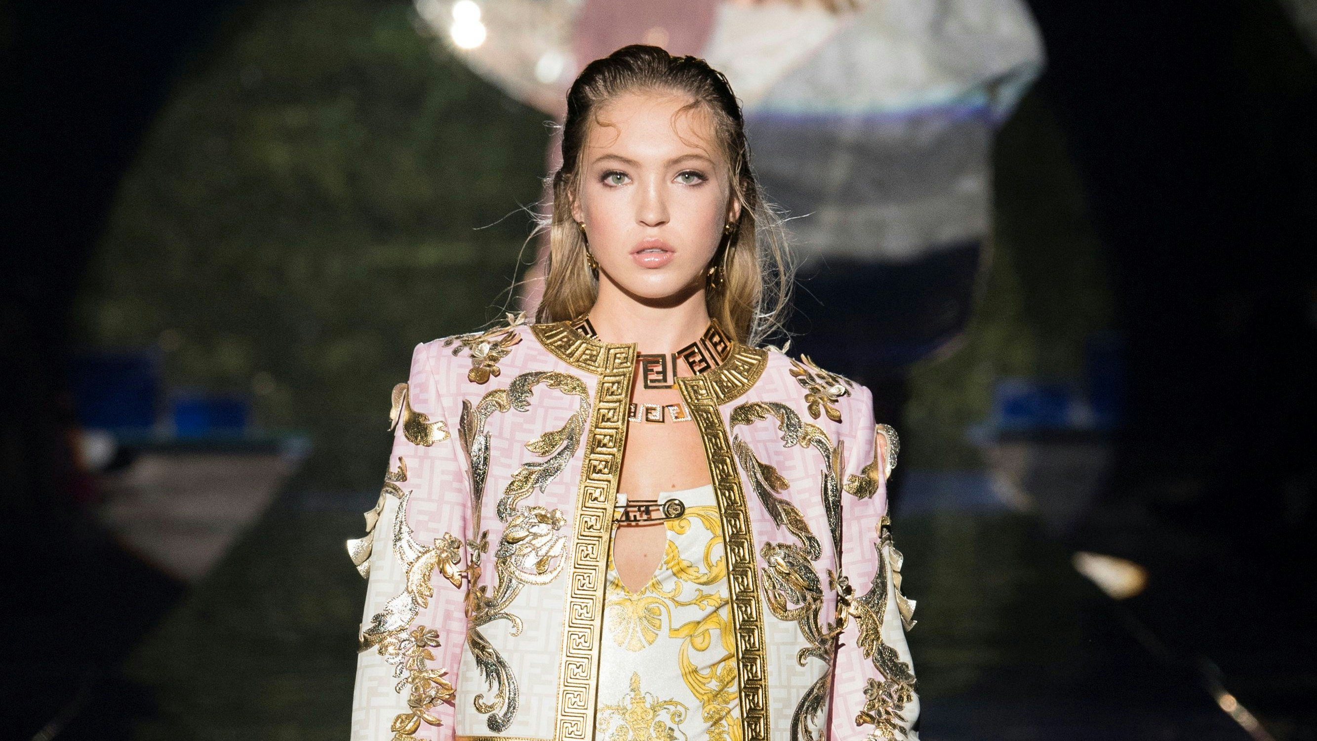 Model Lila Grace Moss Hack presents creations from the Versace by Fendi collection during Milan Fashion Week in Milan, Italy, September 26, 2021. Picture taken September 26, 2021.  Versace and Fendi/Handout via REUTERS - THIS IMAGE HAS BEEN SUPPLIED BY A THIRD PARTY. NO RESALES. NO ARCHIVES MANDATORY CREDIT