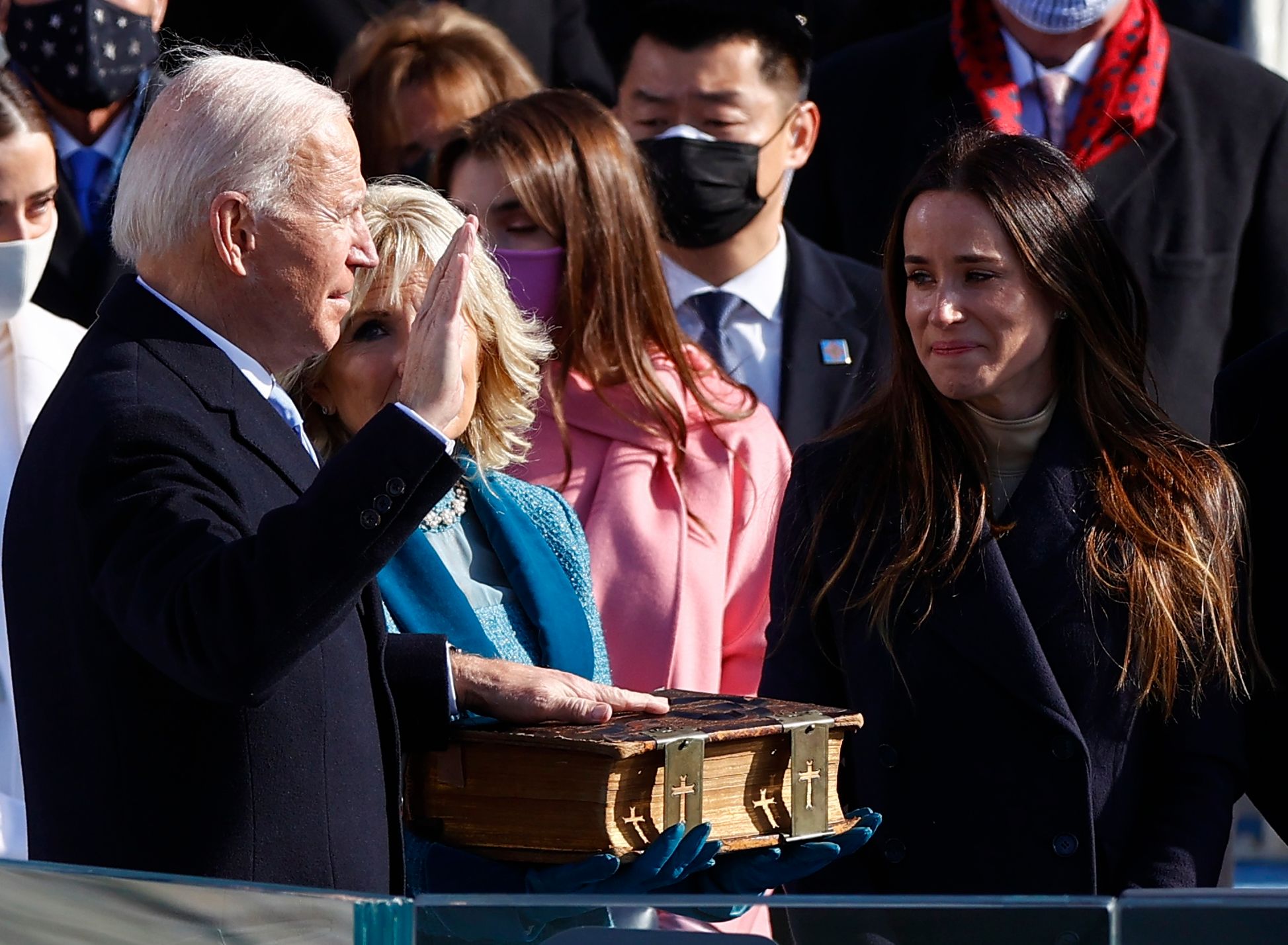 Joe Biden is sworn in as the 46th President of the United States as his wife Jill Biden holds a bible on the West Front of the U.S. Capitol in Washington, U.S., January 20, 2021 REUTERS/Jim Bourg