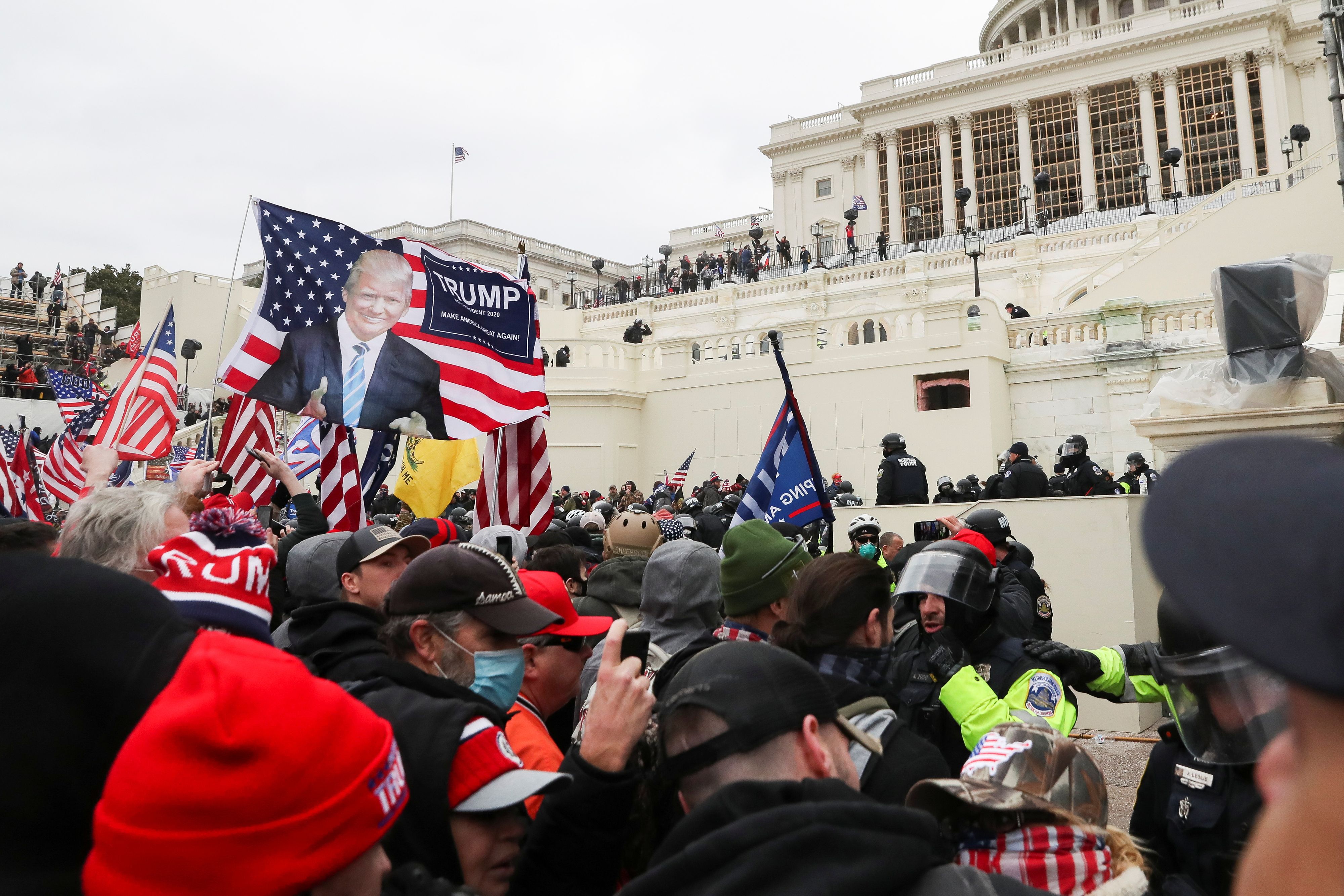 Supporters of U.S. President Donald Trump clash with police officers in front of the U.S. Capitol Building in Washington, U.S., January 6, 2021. REUTERS/Leah Millis