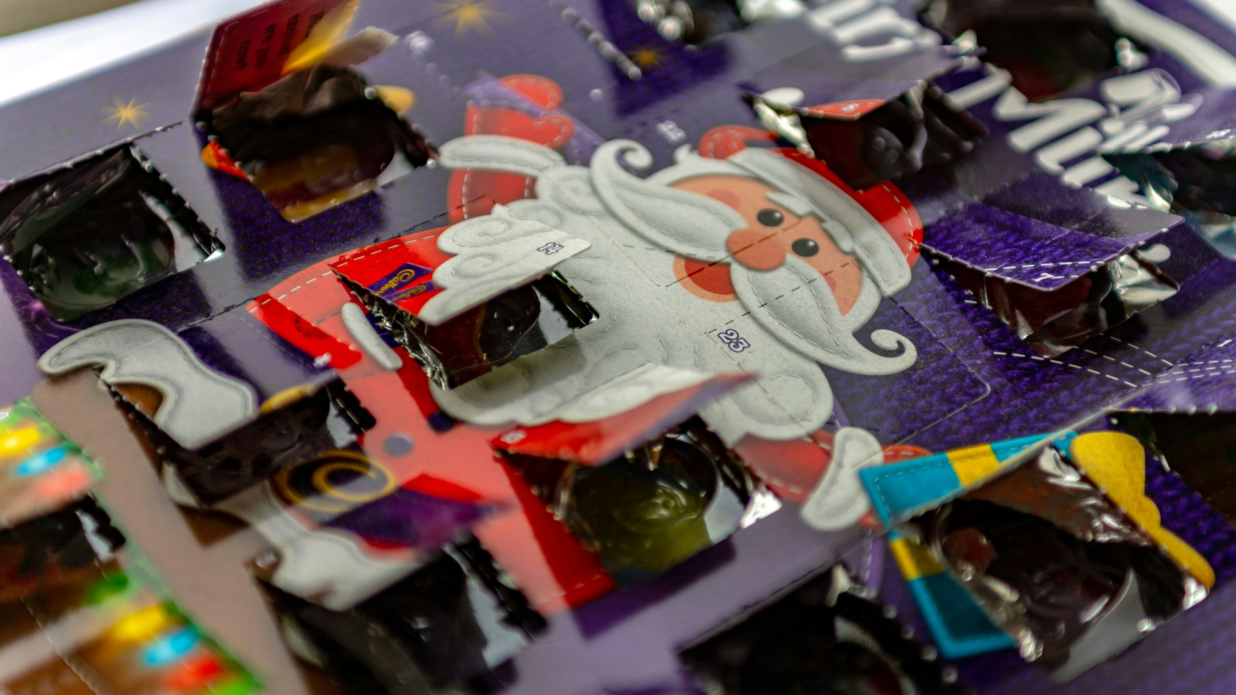 Christmas Advent Calendar with all doors open on Christmas Day. The calendar is a Cadbury's Dairy Milk calendar in a real life situation in Huntingdon, UK.