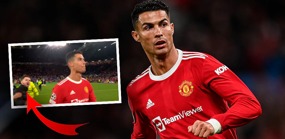 Ein Fan wird kurz vor Cristiano Ronaldo zu Boden gerissen. 