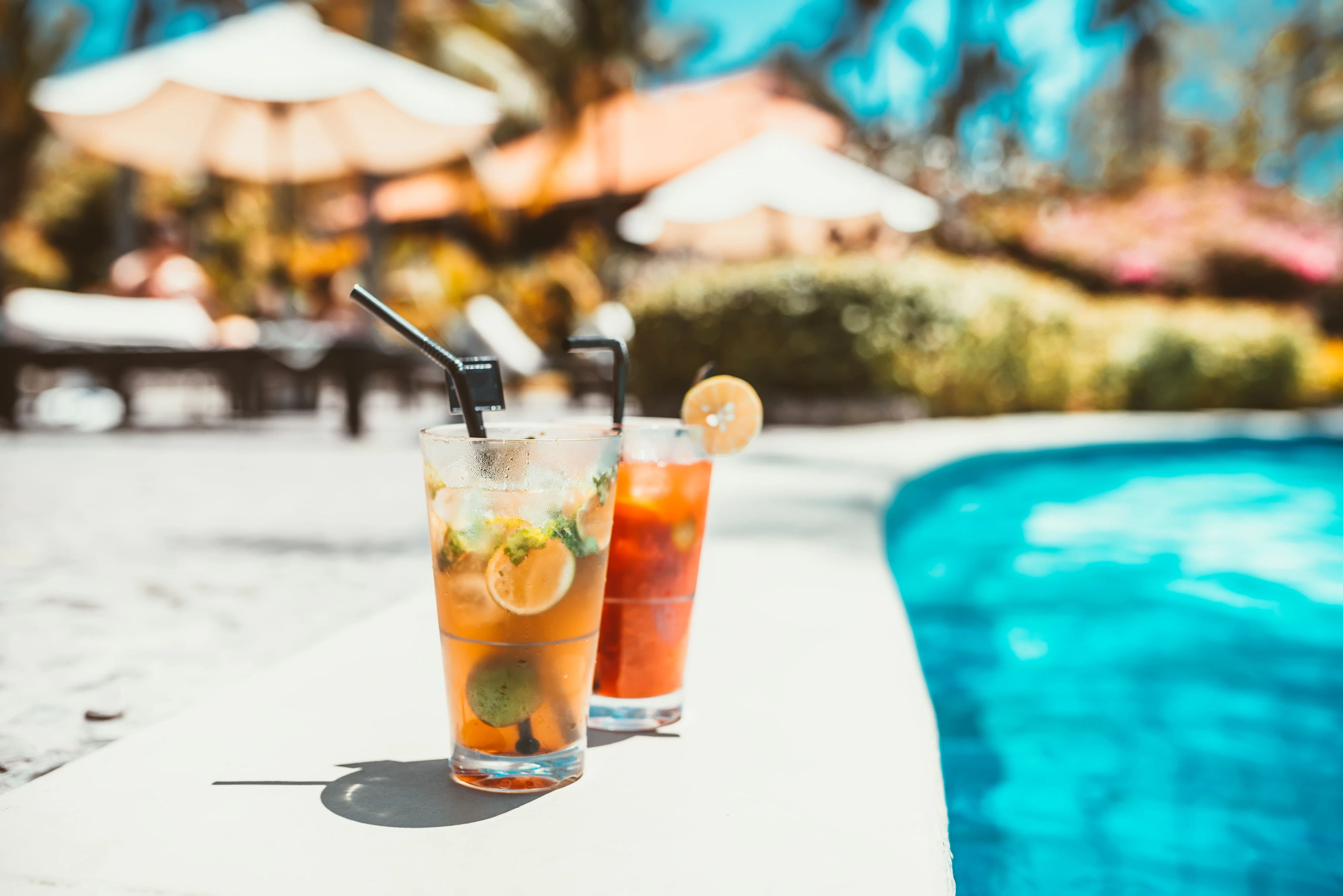 close-up of mojito cocktail drink, selective focus and details. alcoholic drink refreshment at pool