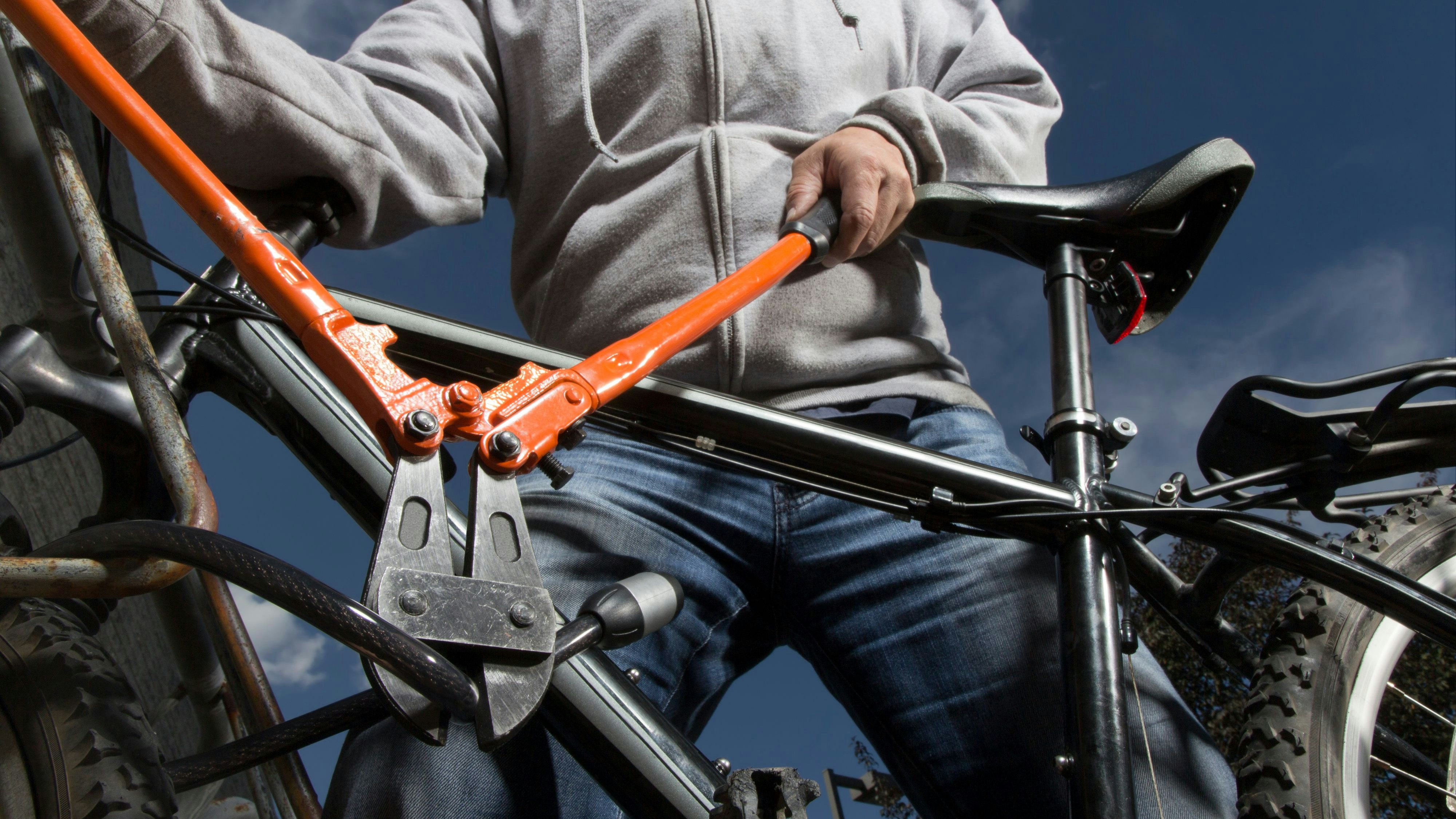 A royalty free image from sports and recreation of a bike theft in progress.