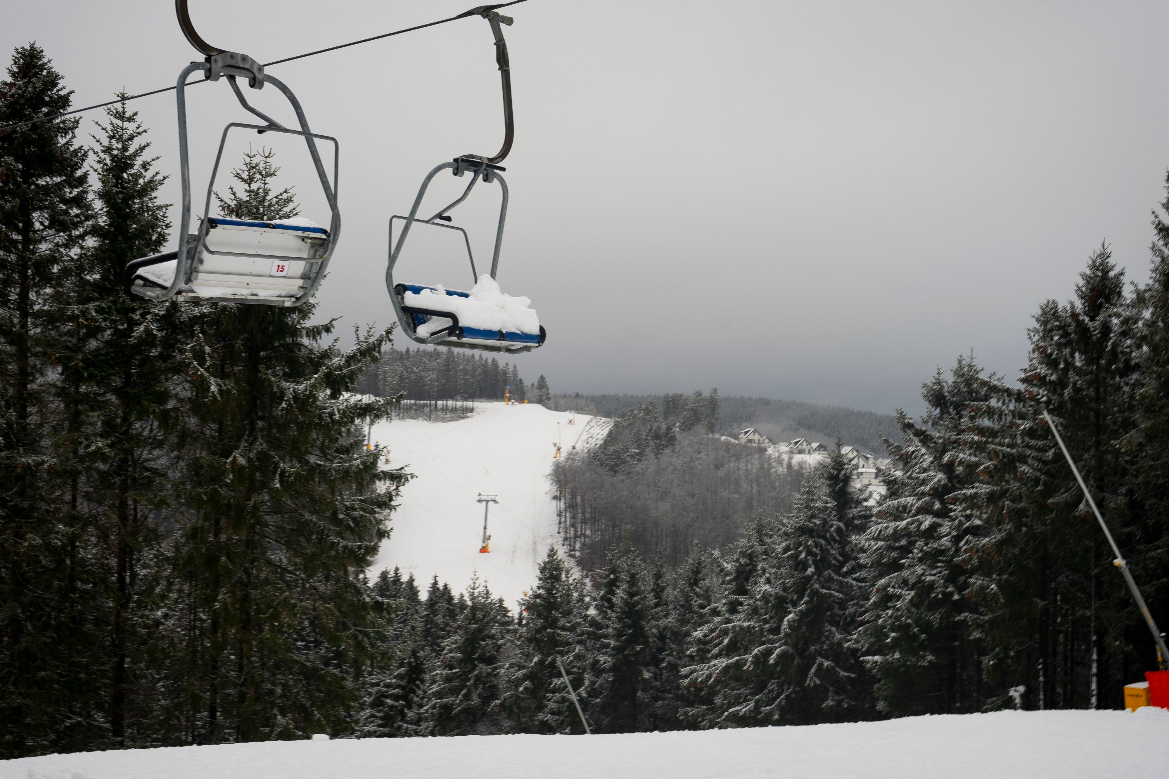 Winterberg, NRW, Germany - 12.07.2020 : Snowed-in chairlift on the ski slopes closed by the corona lockdown, Winterberg, Sauerland.