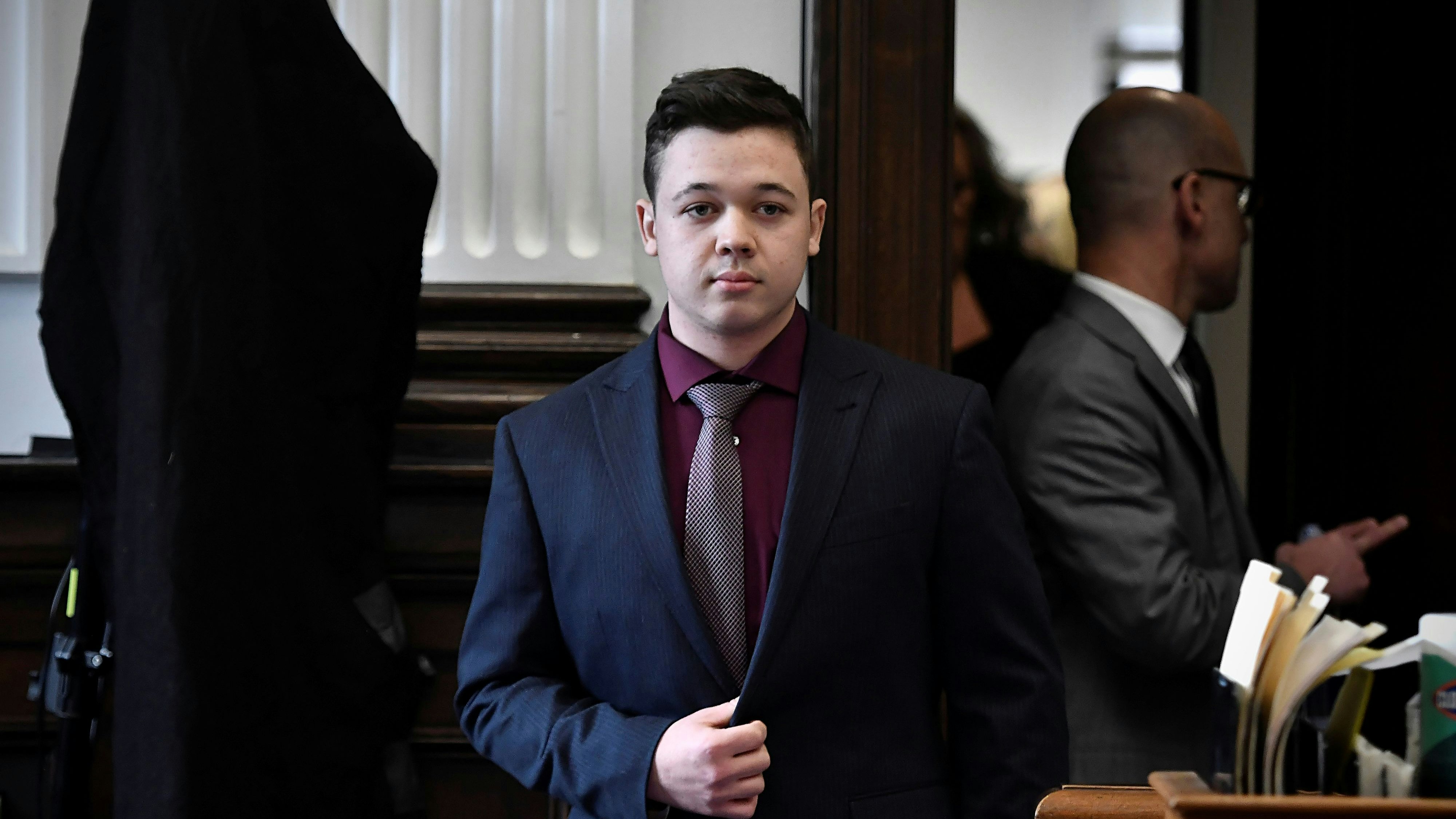 Kyle Rittenhouse walks during his trial at the Kenosha County Courthouse in Kenosha, Wisconsin, U.S., November 19, 2021.  Sean Krajacic/Pool via REUTERS
