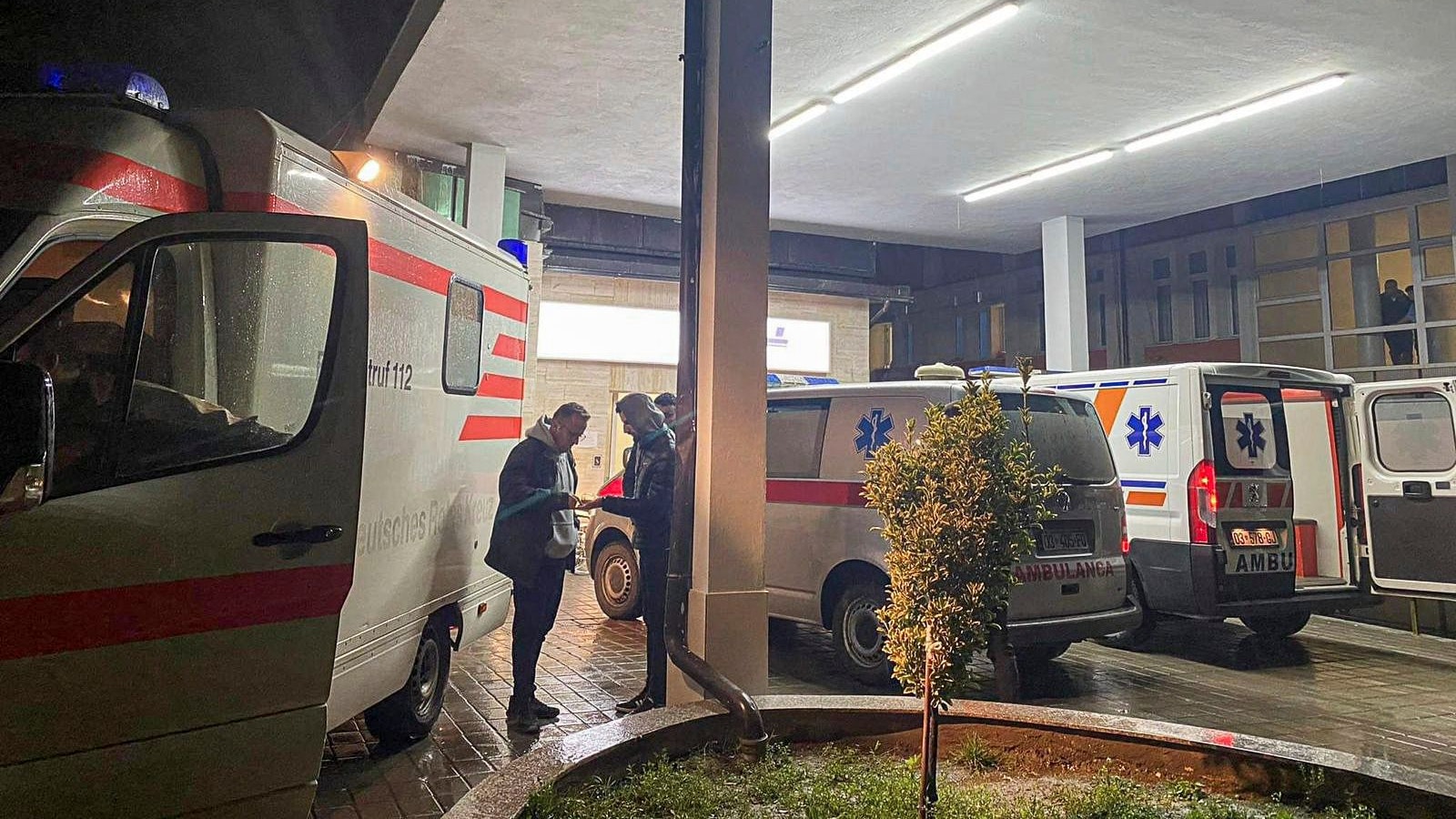 Download von www.picturedesk.com am 27.11.2021 (16:40).  Ambulance vehicles parked in the entrance of the general hospital in the city of Peja after three teenagers were shot in a bus near the village of Glodjane on Friday, Nov. 26, 2021. Police and media reports say an unknown gunman has opened fire on a bus carrying teenagers in western Kosovo, killing three people and injuring one. (AP Photo) - 20211126_PD11730 - Rechteinfo: Rights Managed (RM)