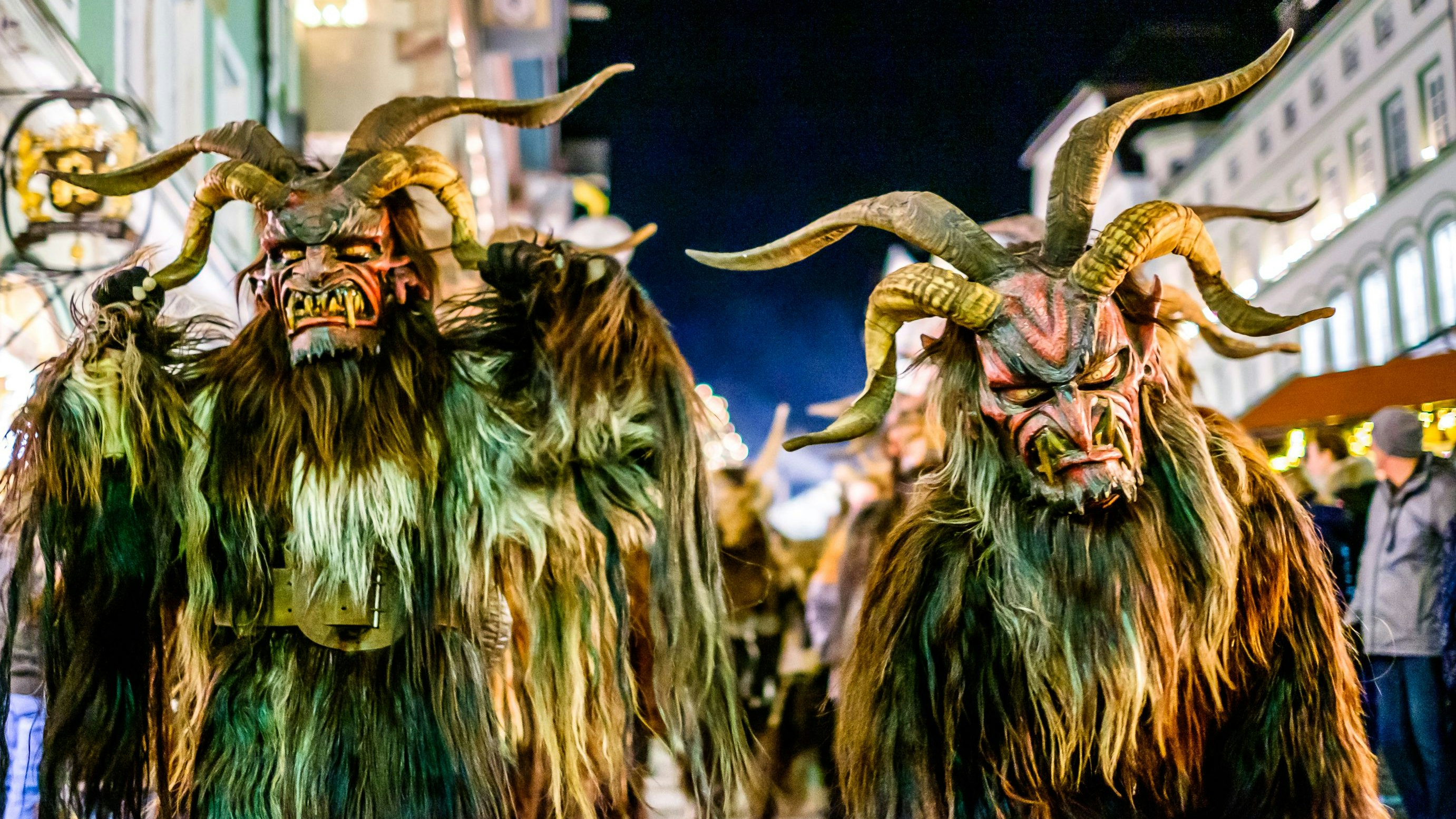 Bad Toelz, Germany - December 8: participant of a traditional pageant called krampuslauf with fantasy costumes and handmade wooden masks on December 8, 2018 in Bad Toelz, Germany
