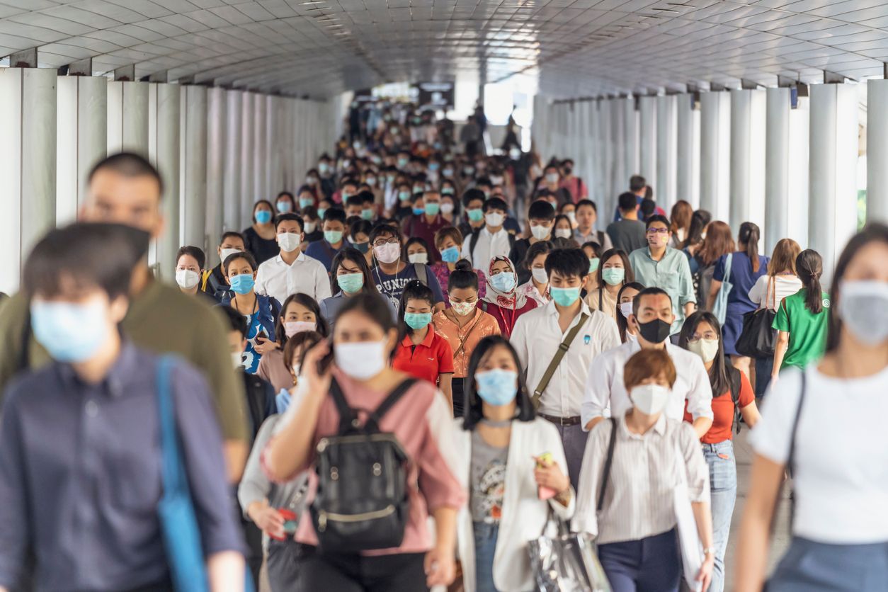 Bangkok, Thailand - Mar 2020 : Crowd of unrecognizable business people wearing surgical mask for prevent coronavirus Outbreak in rush hour working day on March 18, 2020 at Bangkok transportation
