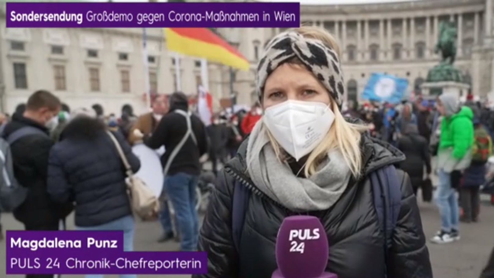 Chef-Reporterin Magdalena Punz berichtet live vor Ort – in Begleitung von Sicherheitsmännern.